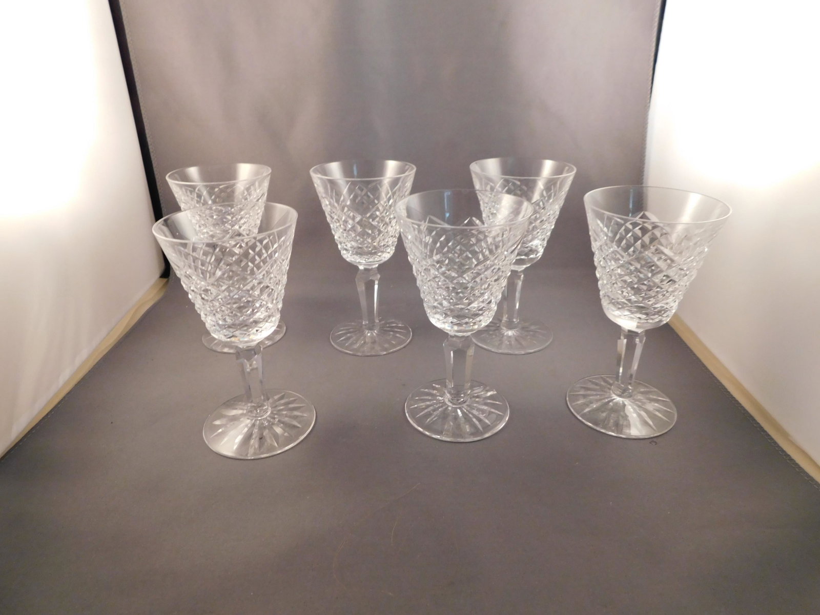 6 Waterford Stems: Set of 6 Waterford port wine stems. Measures approx. 4 1/2" tall. You are bidding at a live sale. Please read the terms and conditions. We are offering no contact pick up at our South Brunswick locati