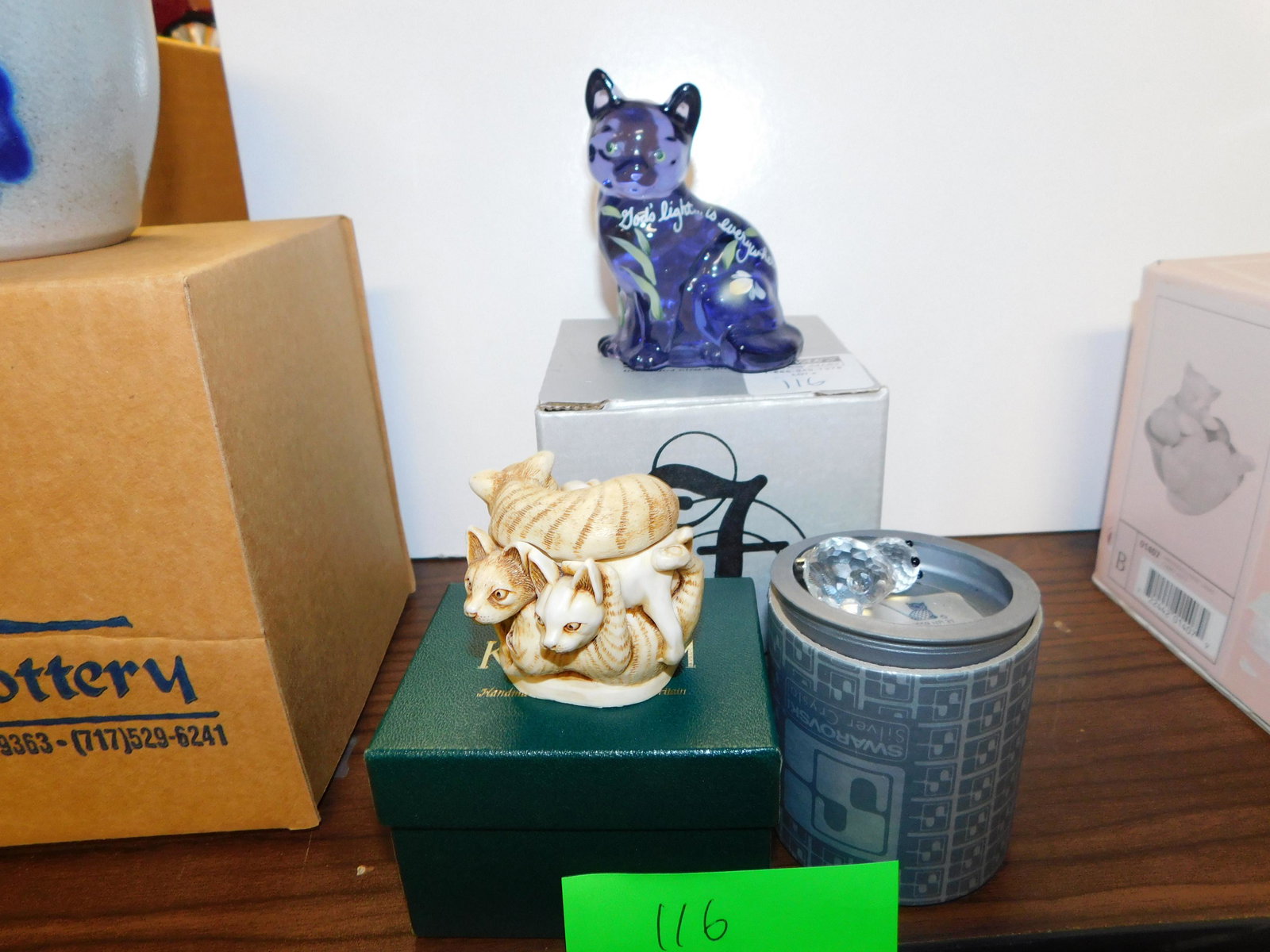 3 Collectible Cats: Fenton art glass cat with box, Harmony Kingdom cat box, and Swarovski cat figurine with box. You are bidding at a live sale. Please read the terms and conditions. LOCAL PICK UP ONLY! No shipping optio