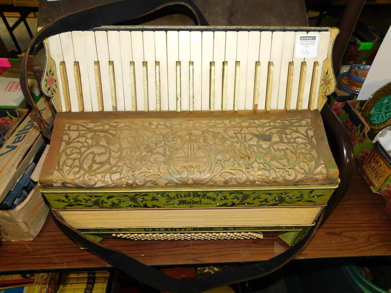 Accordion: Accordion with box. You are bidding at a live sale. Please read the terms and conditions. LOCAL PICK UP ONLY! No shipping options will be offered for this auction. After the auction by APPOINTMENT pic