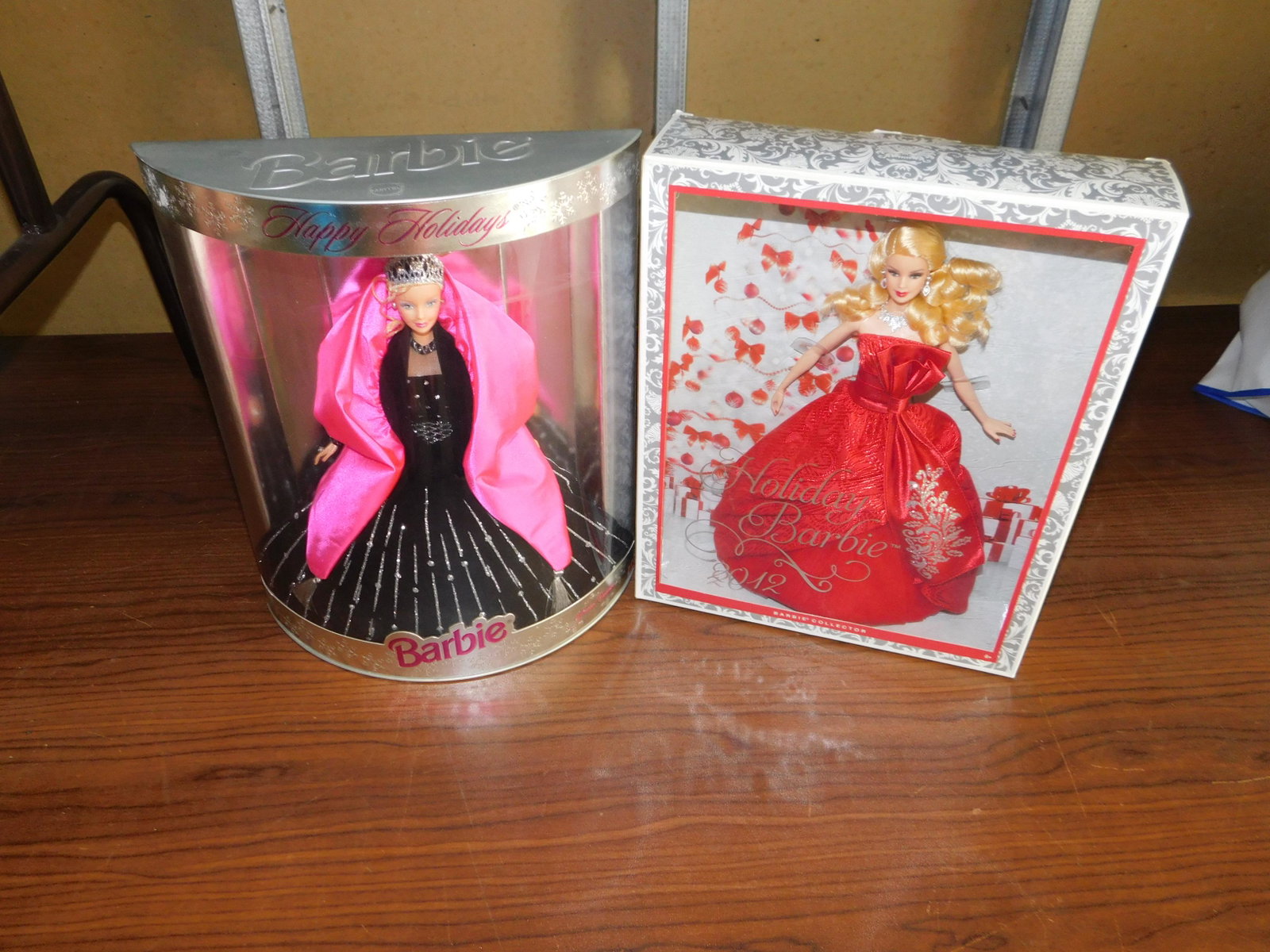 2 Happy Holidays Barbies: Lot of 2 Happy Holidays Barbies including 2012 Holiday Barbie and one other, both in box. You are bidding at a live sale, please read the terms and conditions. We are offering contact-less pick ups at
