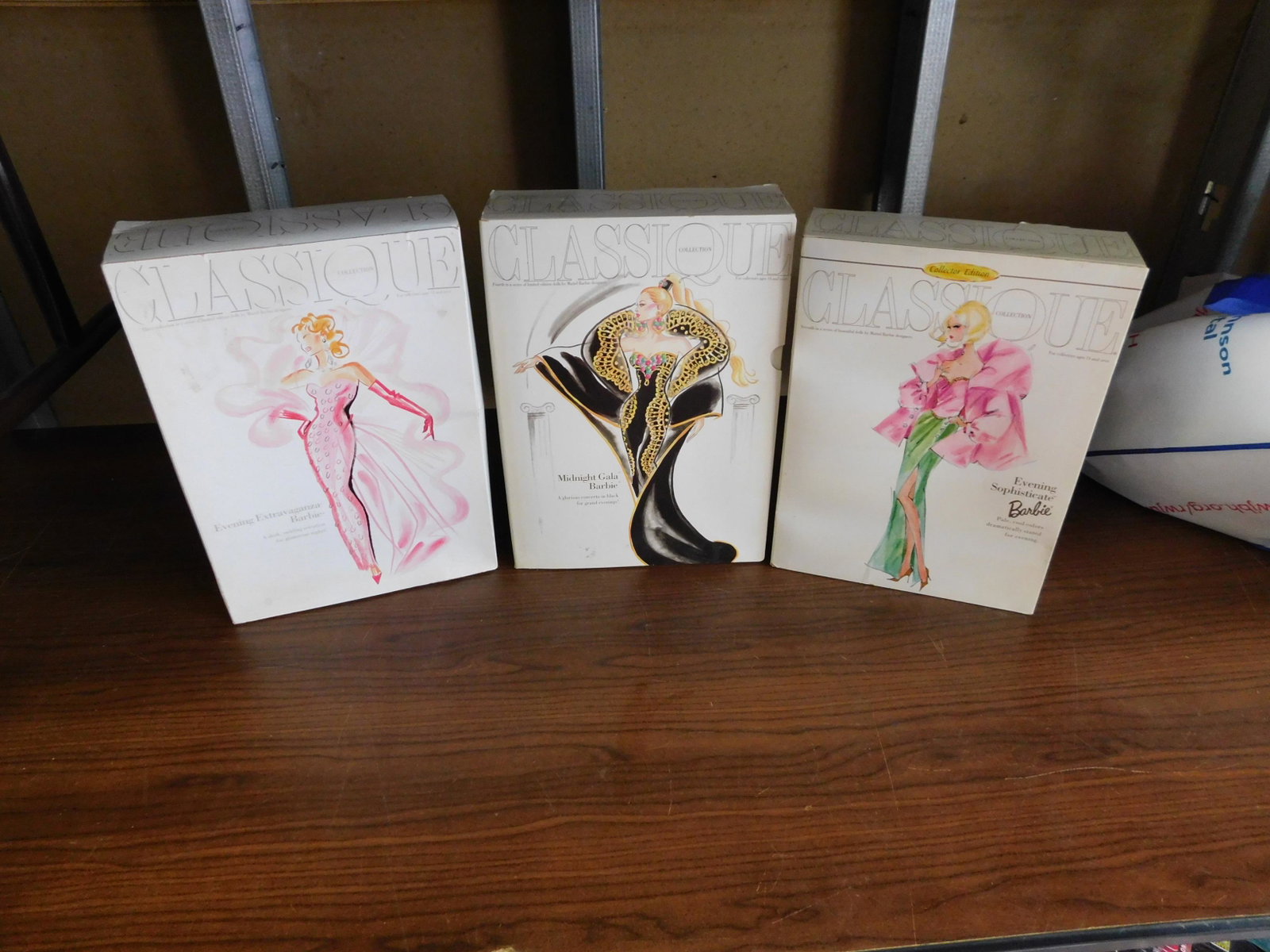 3 Classique Collection Barbies: Lot of 3 Classique Collection Barbies including Midnight Gala, Evening Sophisticate and Evening Extravaganza Barbie. In box. You are bidding at a live sale, please read the terms and conditions. We ar