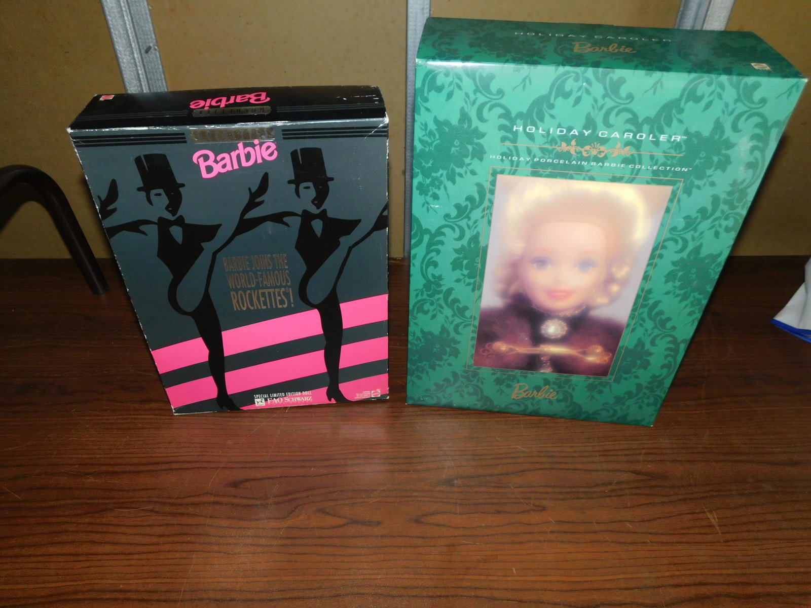 2 Barbies: Lot of 2 Barbies including FAO Schwartz Barbie Joins the World Famous Rockettes, and Holiday Caroler Holiday Porcelain Collection Barbie. In box. You are bidding at a live sale, please read the terms 