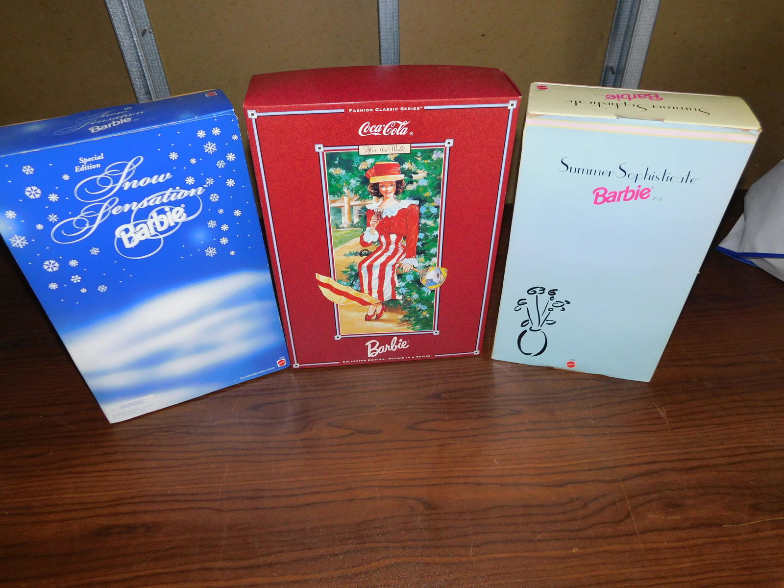 3 Barbies: Lot of 3 Barbies including Coca-Cola After the Walk Barbie Fashion Classic Series - first in a series, Snow Sensation Barbie, and Summer Sophisticate Barbie, Spiegel, in box. You are bidding at a live