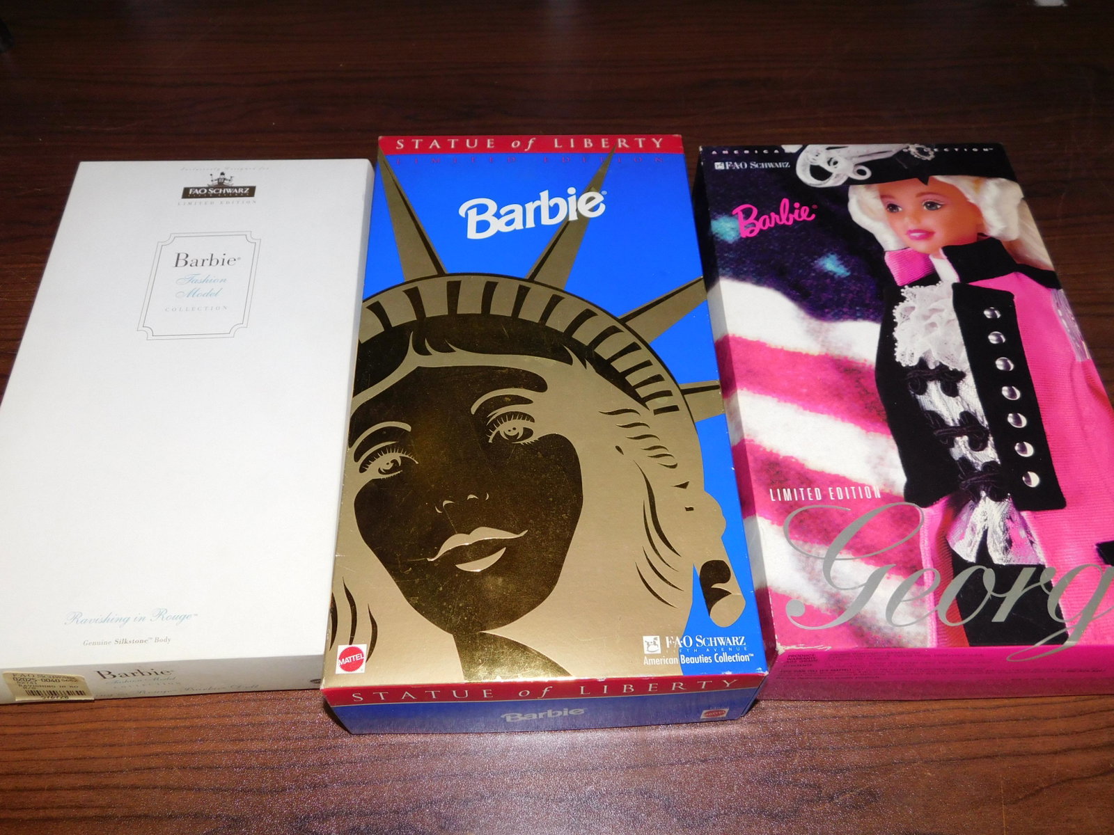 3 Barbies: Lot of 3 Barbies including FAO Schwartz Statue of Liberty Barbie, FAO Schwartz George Barbie - American Beauties Collection, and FAO Schwartz Barbie Fashion Model Collection - Ravishing in Rouge, in b