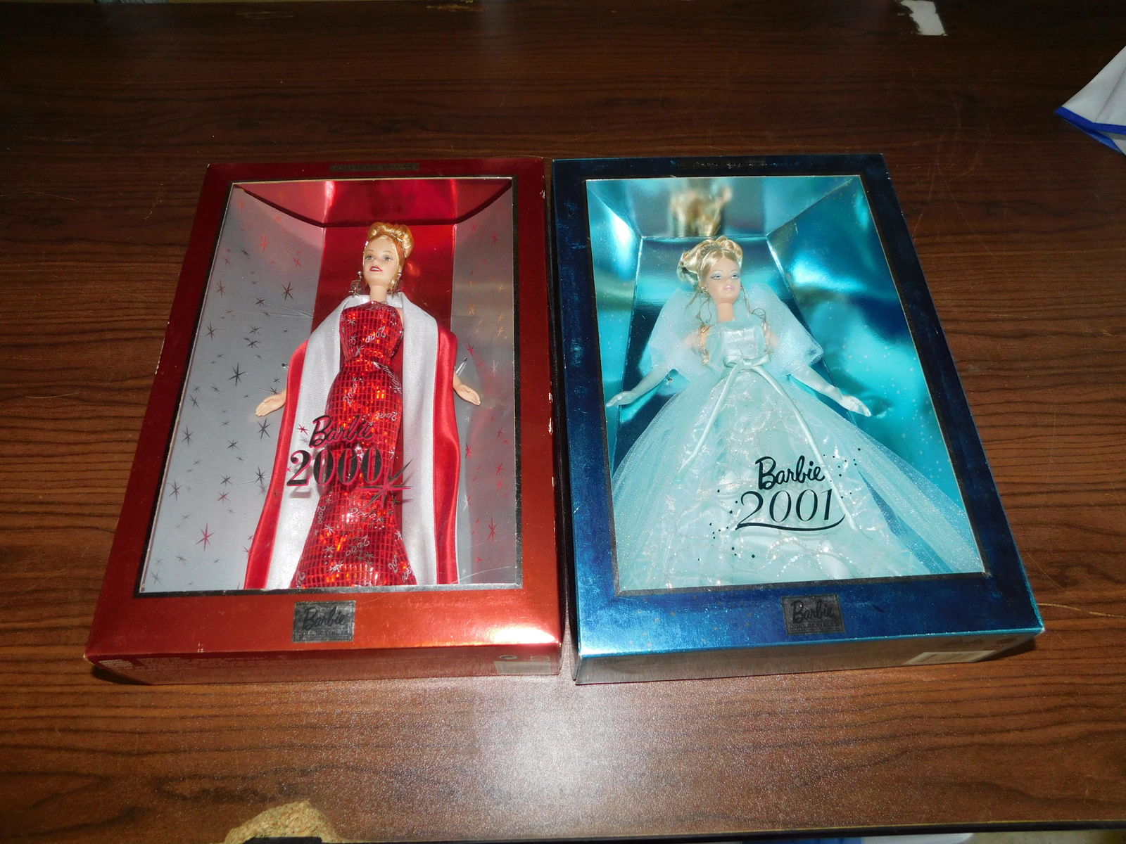 2 Barbies: Lot of 2 Barbies including Barbie 2000 and Barbie 2001. In box. You are bidding at a live sale, please read the terms and conditions. We are offering contact-less pick ups at our South Brunswick locat