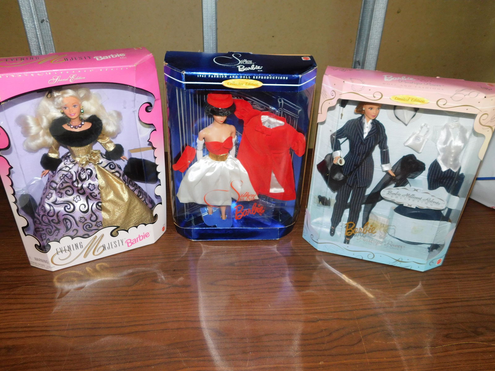 3 Barbies: Lot of 3 Barbies including Evening Majesty - Evening Elegant Series, Barbie Pinstripe Power - Barbie Millicent Roberts Collection, and Silken Flame Barbie - 1962 Fashion and doll reproduction.