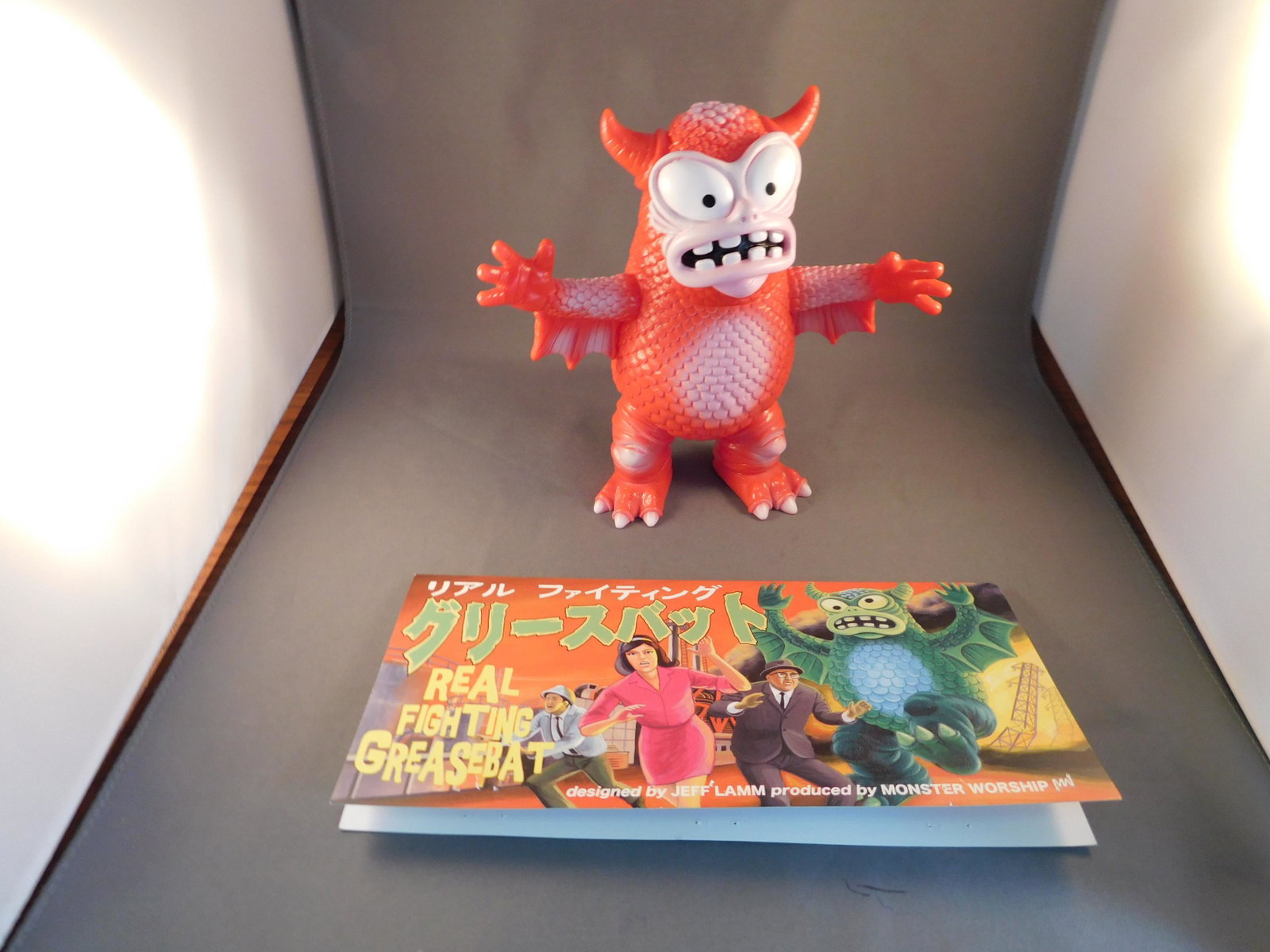 Japanese Vinyl Real Fighting Greasebat, Red: Japanese Vinyl real fighting Greasebat. Red. Signed Jeff Lamm 2010. Measures approx. 6 1/2" tall. You are bidding at a live sale, please read the terms and conditions. We are offering contact-less pic