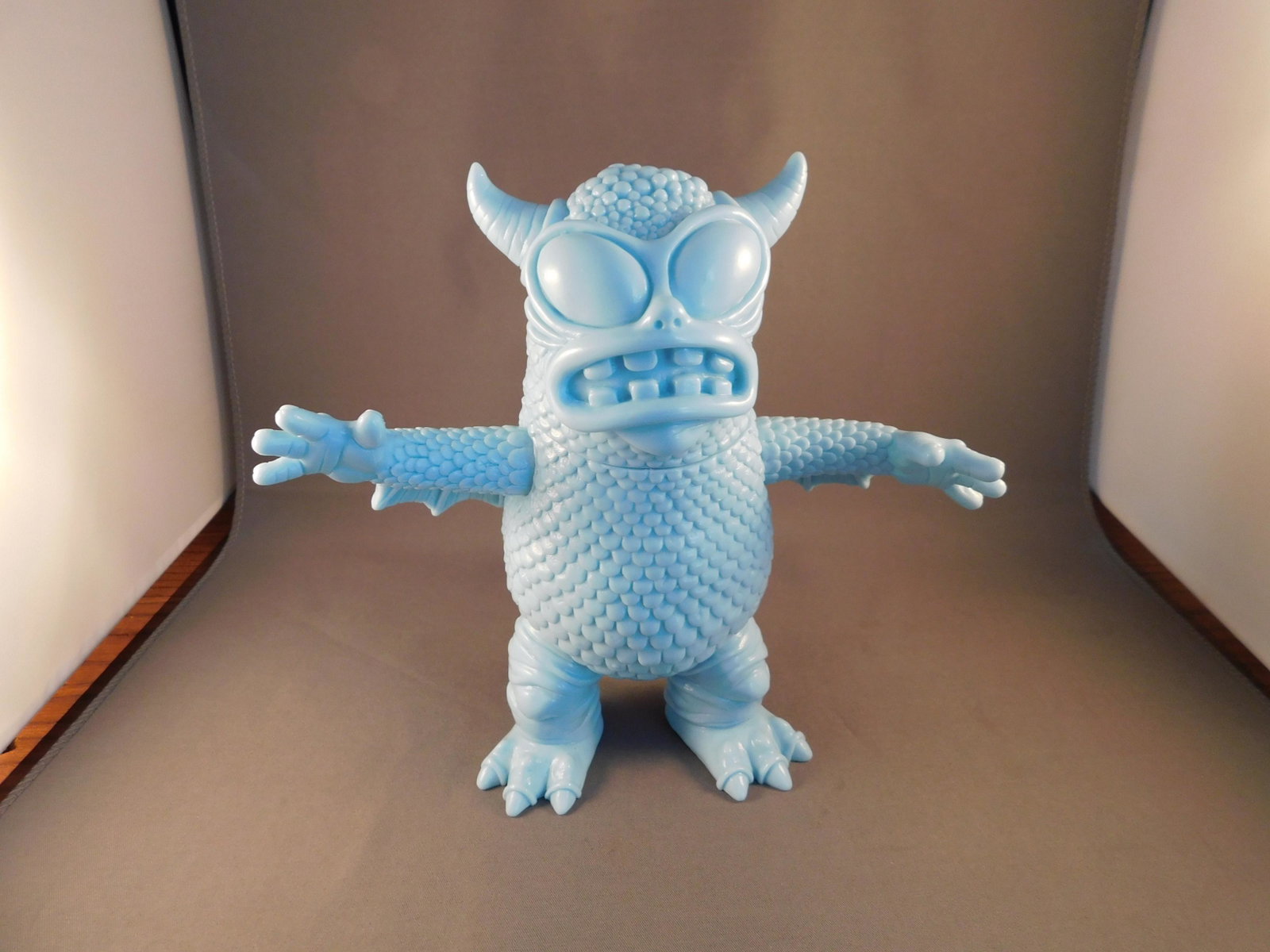 Japanese Vinyl Real Fighting Greasebat, Blue: Japanese Vinyl real fighting Greasebat. Blue. Signed Jeff Lamm, 2010. Measures approx. 6 1/2" tall. You are bidding at a live sale, please read the terms and conditions. We are offering contact-less p