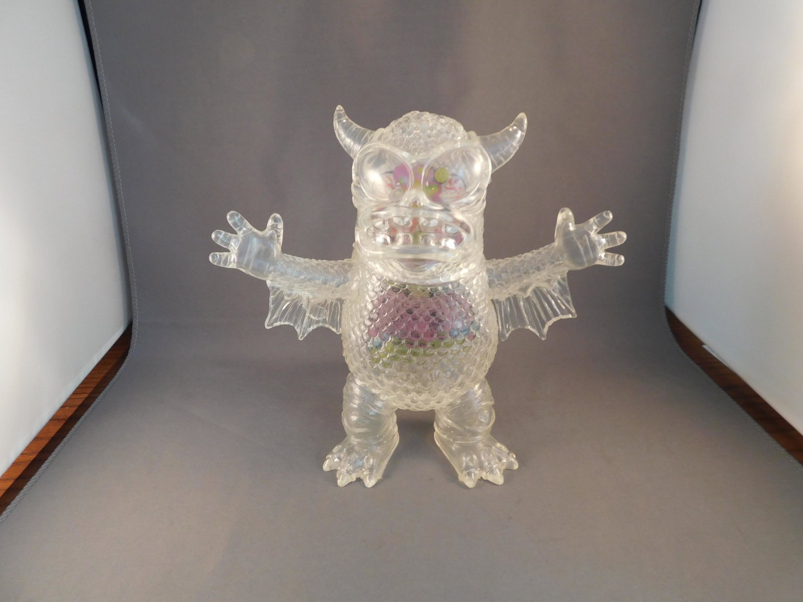 Japanese Vinyl Greasebat, Clear: Japanese Vinyl real fighting Greasebat, clear. Signed Jeff Lamm, 2010. Measures approx. 6 1/2" tall. You are bidding at a live sale, please read the terms and conditions. We are offering contact-less 