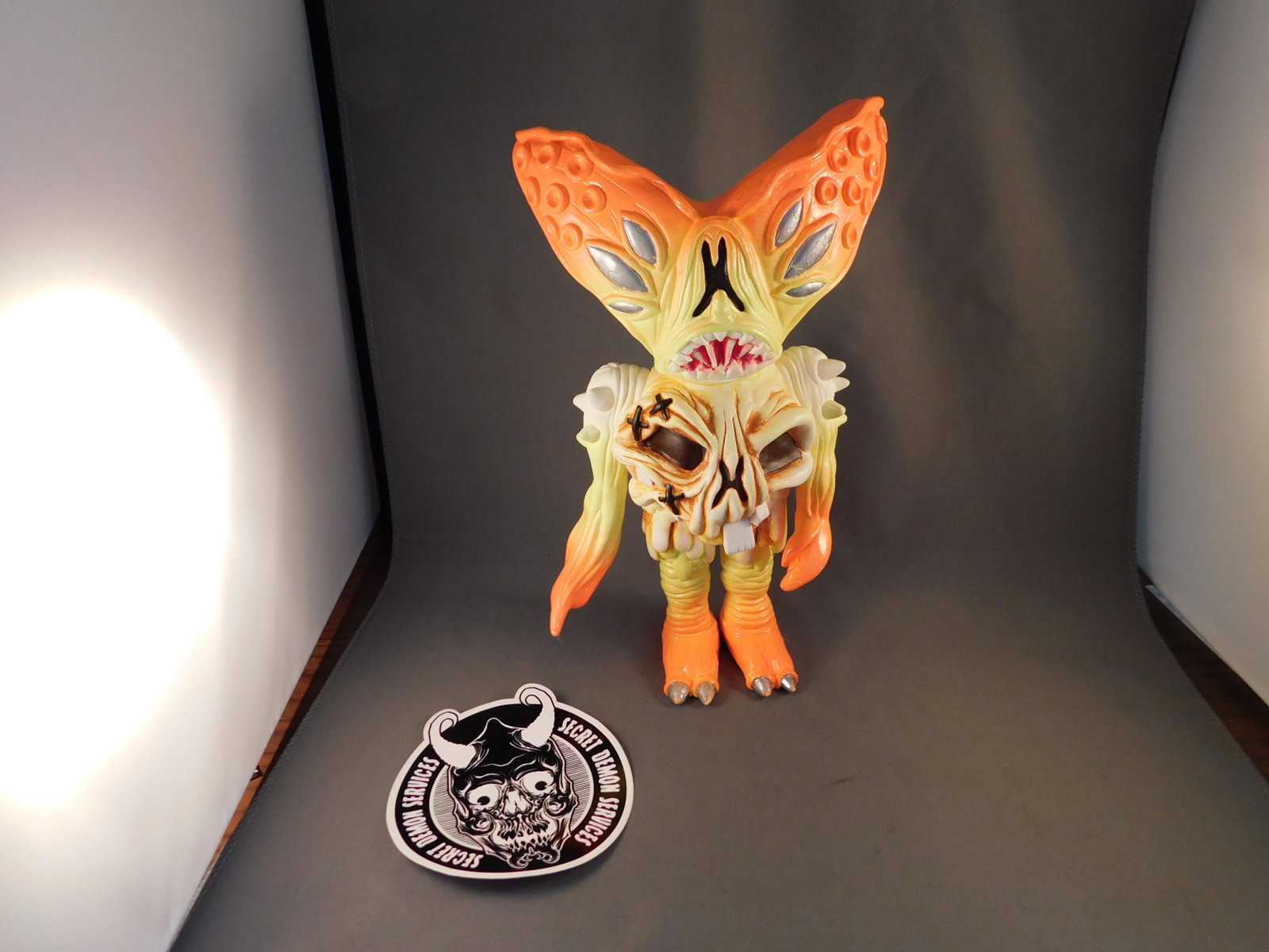 Candy Corn Blood Thrust: Japanese vinyl Candy Corn Blood Thrust by Brent Nolasco, 2014. Tag toys. With bag. Measures approx. 9" tall. You are bidding at a live sale, please read the terms and conditions. We are offering conta
