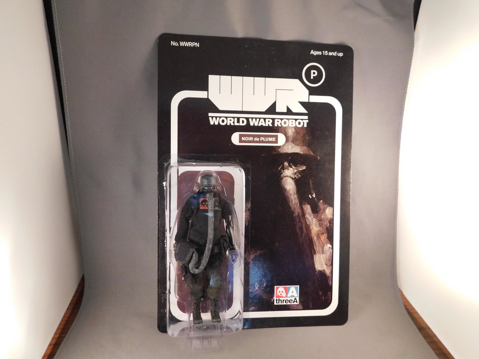 WWR Noir de Plume: A Three A WWR World War Robot Noir de Plume. On original card and in original shipper. Measures approx. 6" tall. You are bidding at a live sale, please read the terms and conditions. We are offering c
