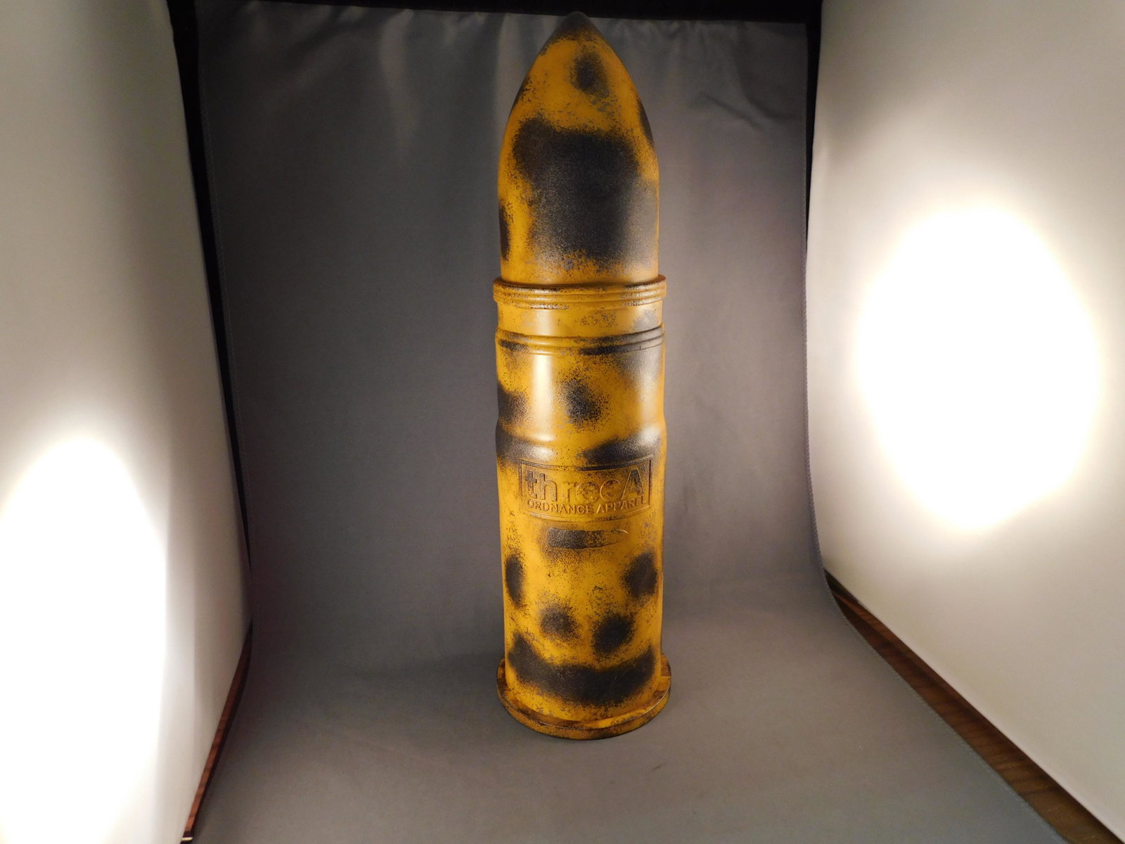 A Three A Old Guard Life-sized T-Shirt with Mortar: A Three A Old Guard T King life-size T shirt inside mortar shell container. Has original shipper and plastic bag. Measures approx. 14" tall. You are bidding at a live sale, please read the terms and c