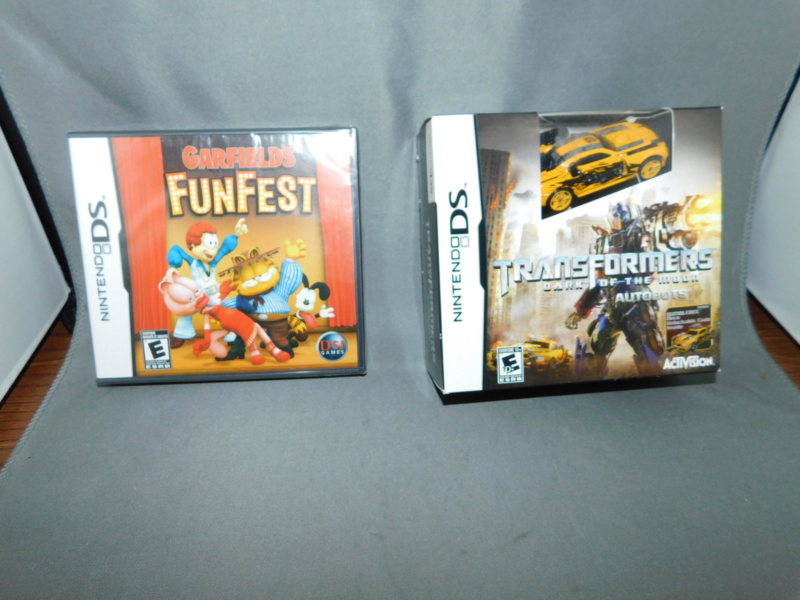 2 Nintendo 3DS Games: Garfield's Fun Fest and Transformers Dark of the Moon Autobots both for Nintendo 3DS. Factory sealed. You are bidding at a live sale, please read the terms and conditions. We are offering contact-less