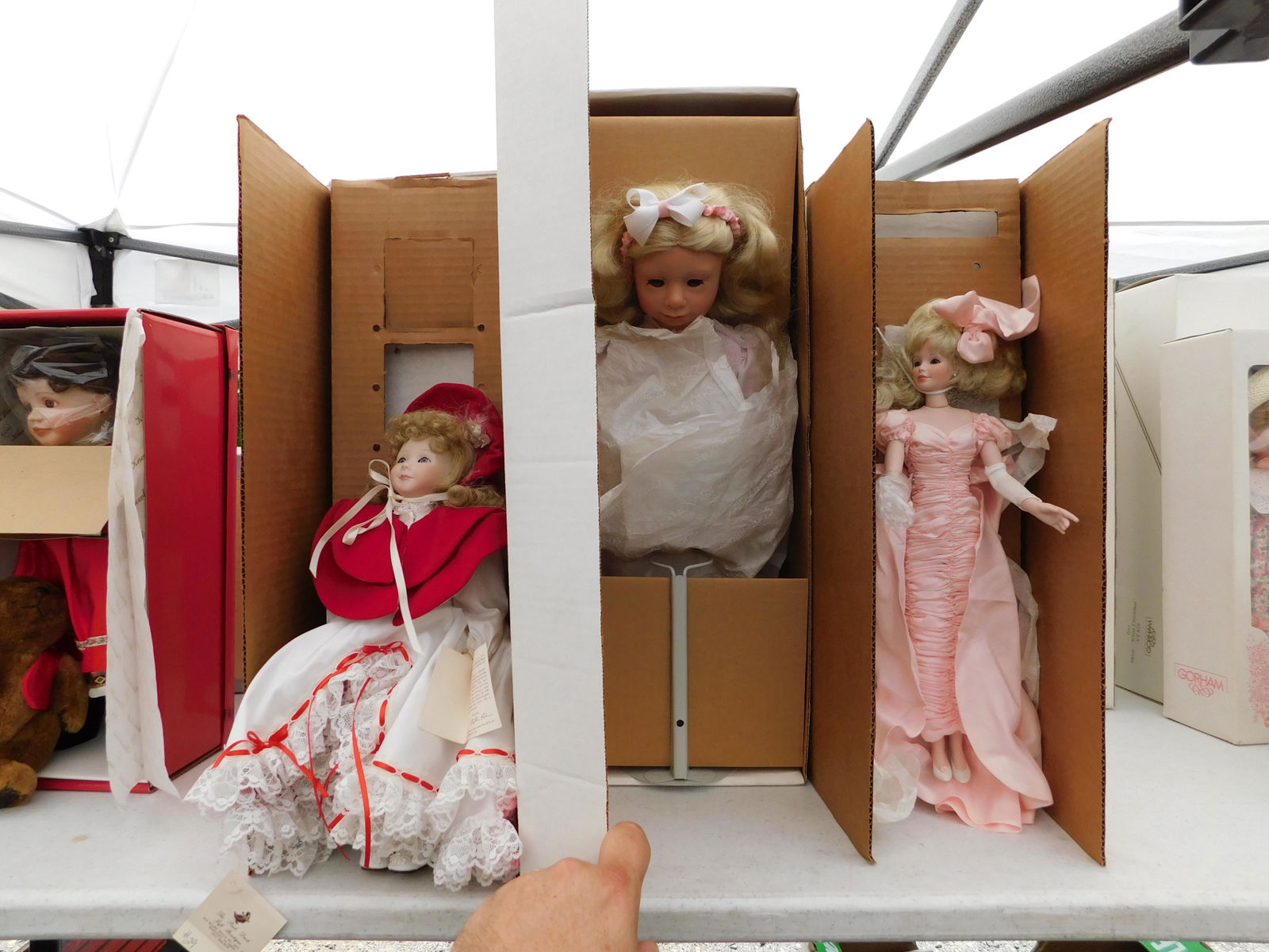 3 Dolls: Lot of 3 dolls in the original boxes. You are bidding at a live sale. Please read the terms and conditions. This sale will be broadcast live on sale day with full descriptions of each lot being sold,