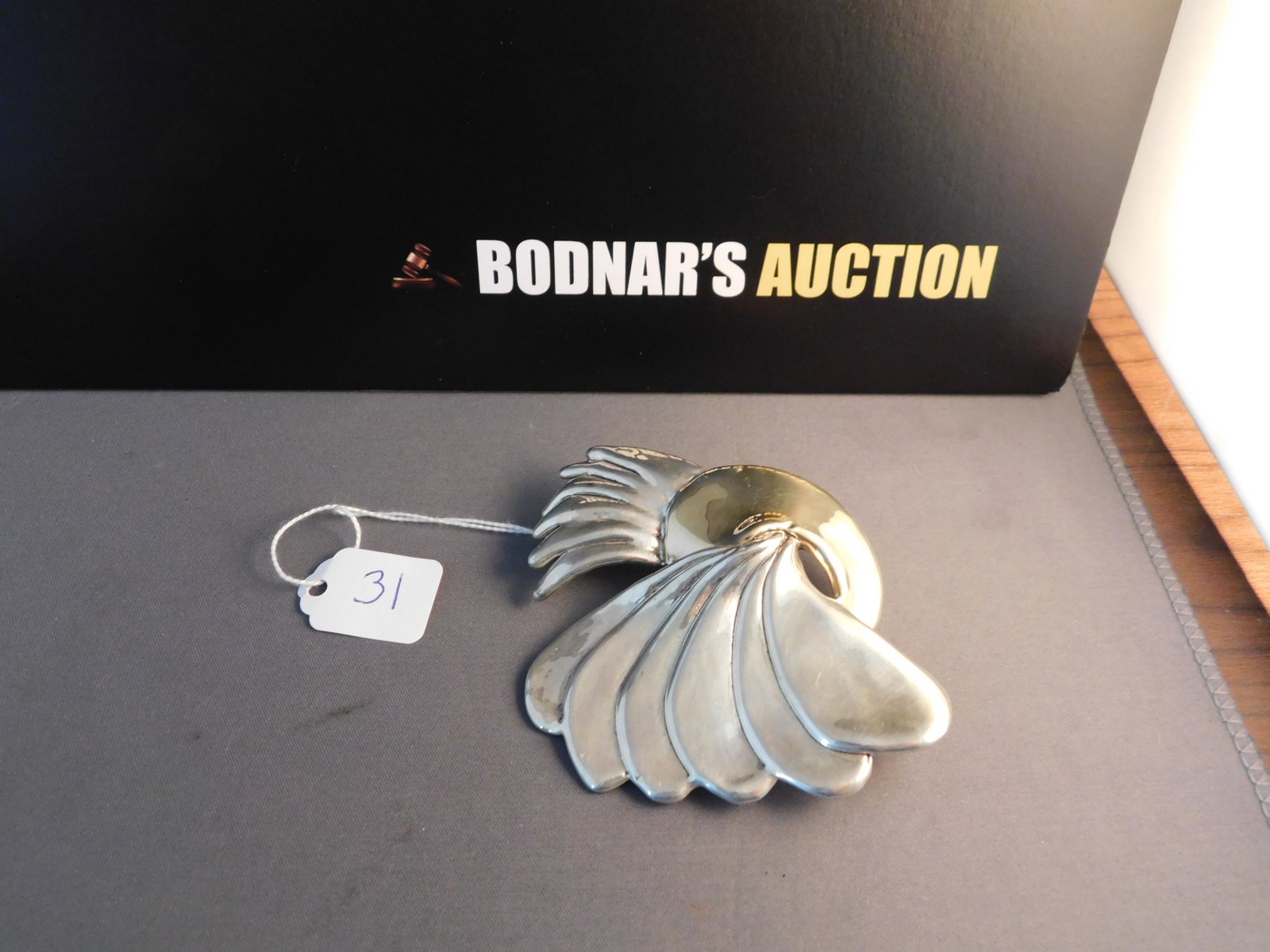 Sterling Modern Pin Pendant: Sterling silver foiled pendant by Varsano of Israel. Marked on back. Measures 3 1/4". You are bidding at a live sale. Please read the terms and conditions. We are offering no contact pick up at our So