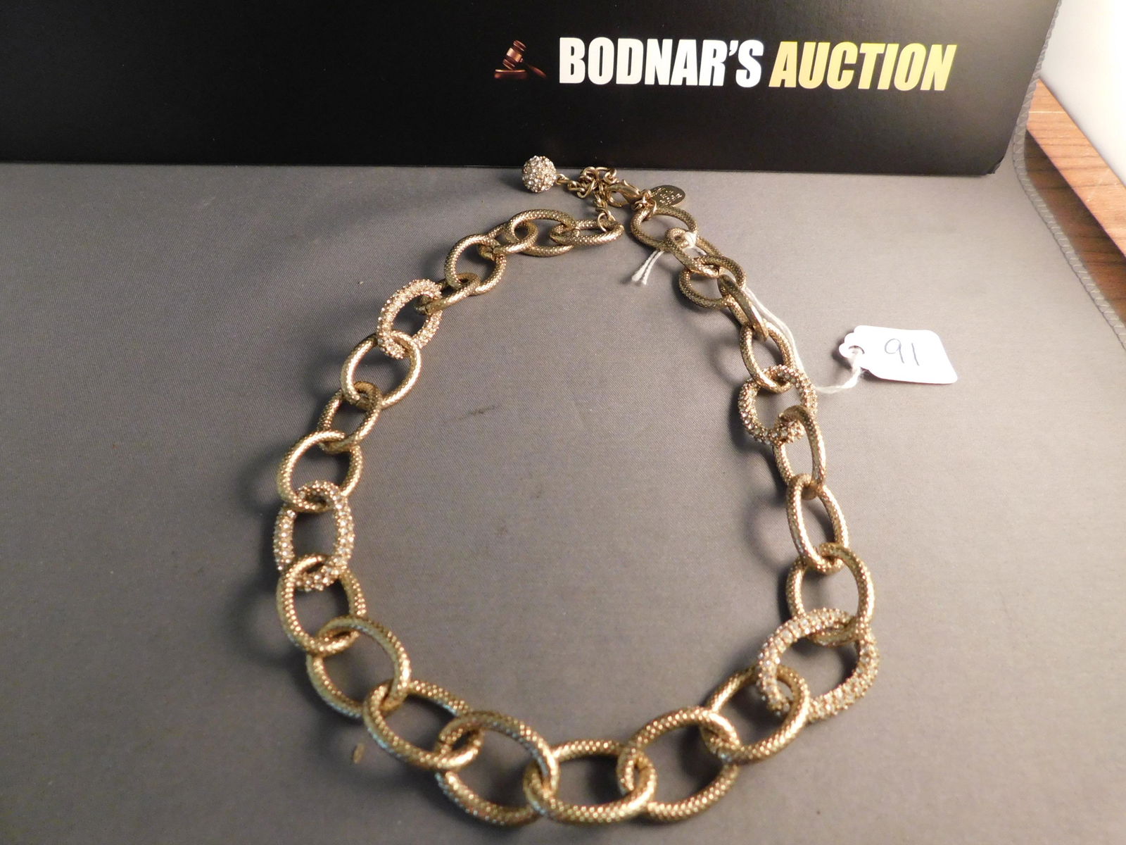 Loulou de la Falaise Necklace: Loulou de la Falaise gold tone & crystal necklace. Marked on tag near clasp. Measures 20". You are bidding at a live sale. Please read the terms and conditions. We are offering no contact pick up at o