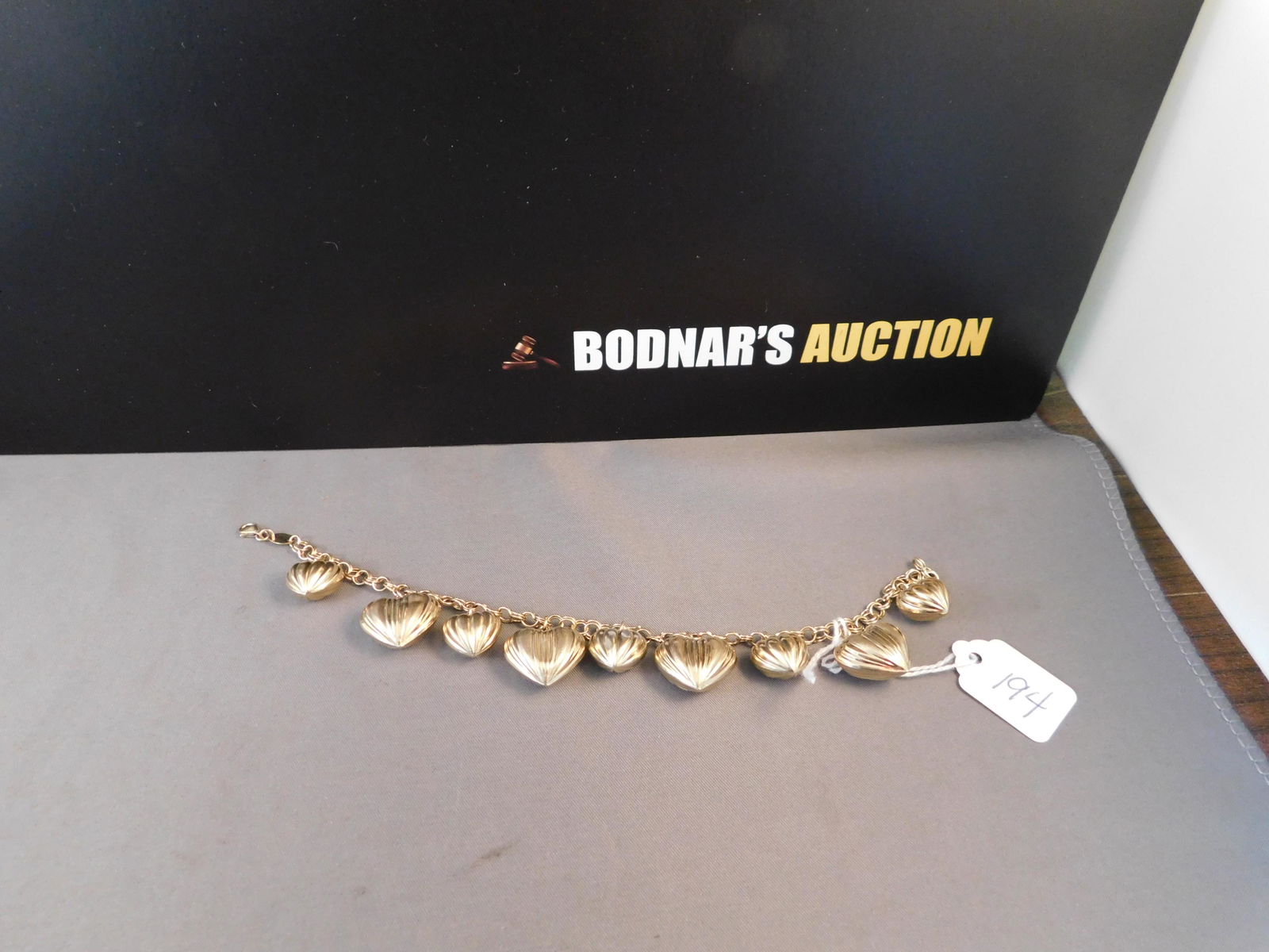 Sterling Gold Vermeil Heart Bracelet: JCM sterling silver gold vermeil puffy heart bracelet. Marked near clasp. Measures 7 1/2". You are bidding at a live sale. Please read the terms and conditions. We are offering no contact pick up at o