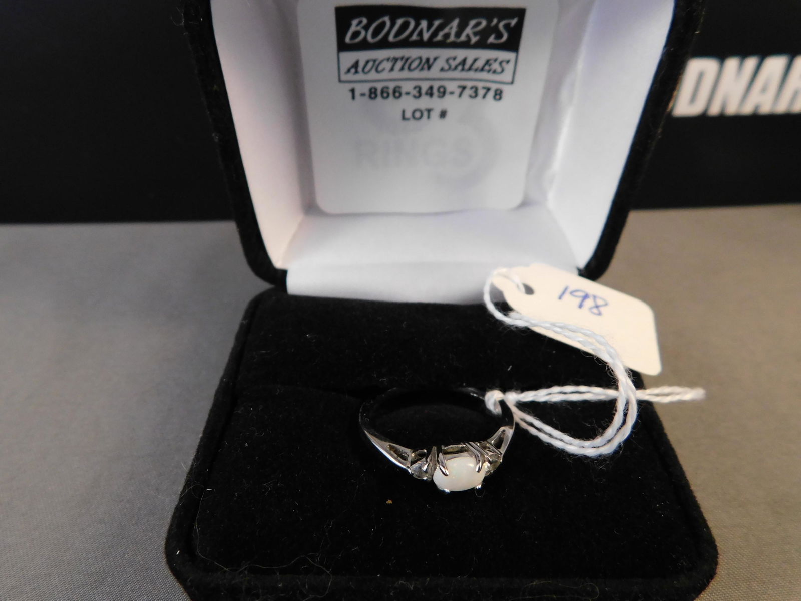 Sterling Opal Ring: Sterling silver & opal ring. Marked on the inside. Size 8. You are bidding at a live sale. Please read the terms and conditions. We are offering no contact pick up at our South Brunswick location. Pic