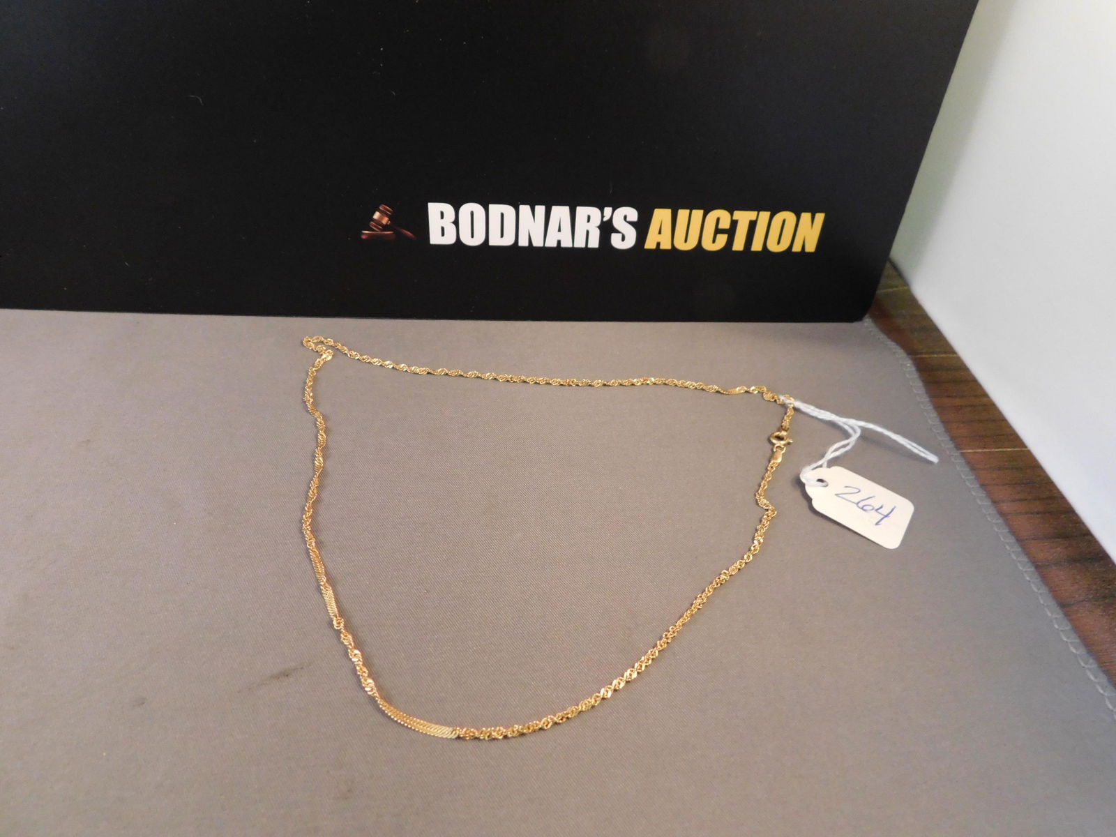 14K Gold Necklace: 14K yellow gold necklace. Marked at clasp. Measures 18". You are bidding at a live sale. Please read the terms and conditions. We are offering no contact pick up at our South Brunswick location. Pick
