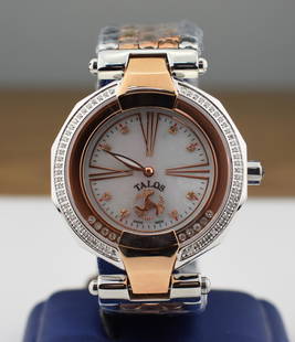 Talos Diamond Watch: Talos diamond quartz wrist watch 86 Diamonds 0.51 CTS. Unworn, floating diamonds. Dial measures approx. 1 1/2 " across. You are bidding at a live sale. Please read the terms and conditions. We are off