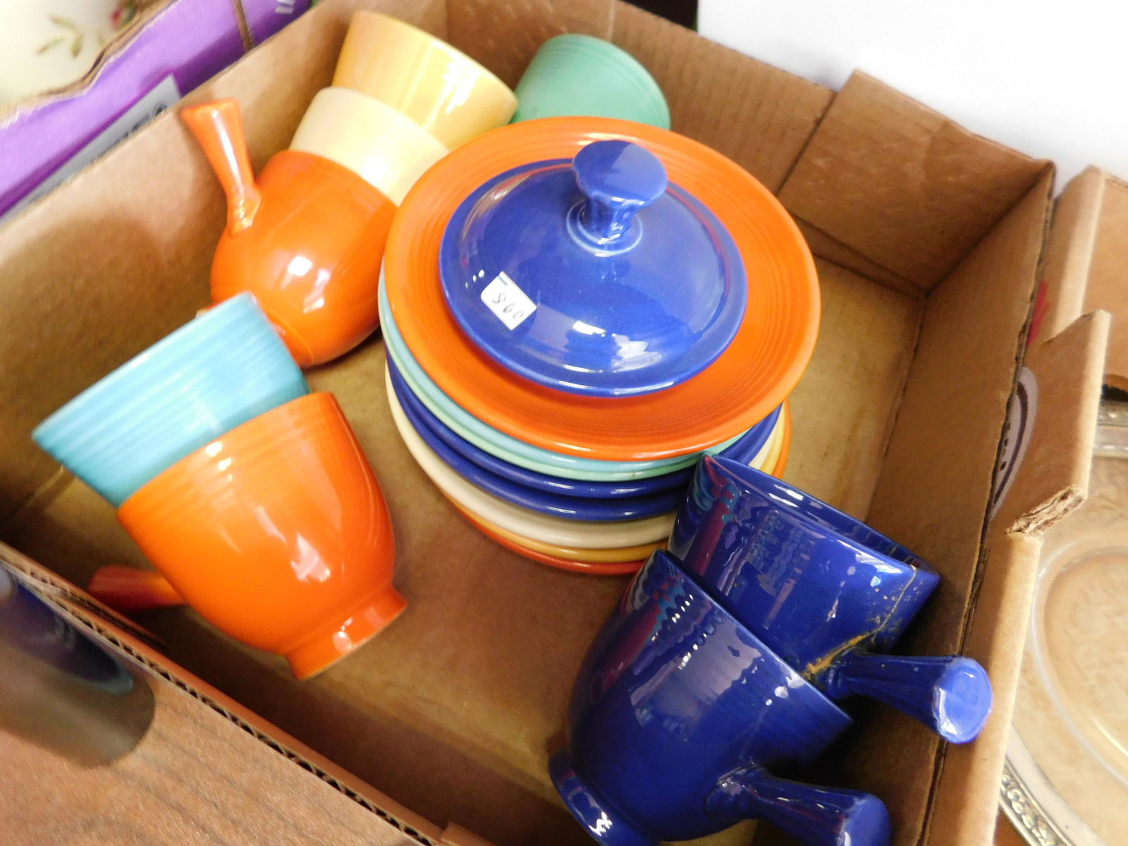 Lot of Fiestaware: Lot of Fiestaware You are bidding at a live sale. You are bidding at a live sale. Please read the terms and conditions. This sale will be broadcast live on sale day with full descriptions of each lot