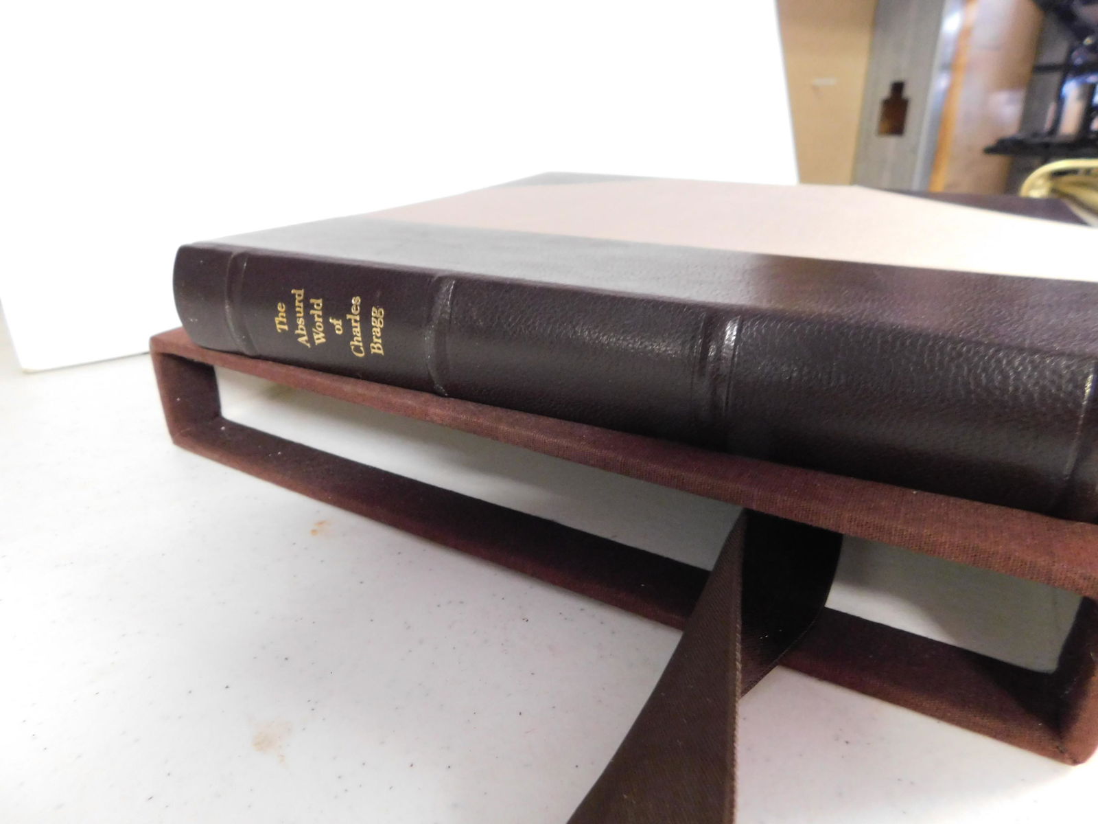 Leather-bound The Absurd World of Charles Bragg: Leather-bound The Absurd World of Charles Bragg Signed and #466 by Author. Comes with original Sleeve. You are bidding at a live sale. Please read the terms and conditions. We are offering no contact