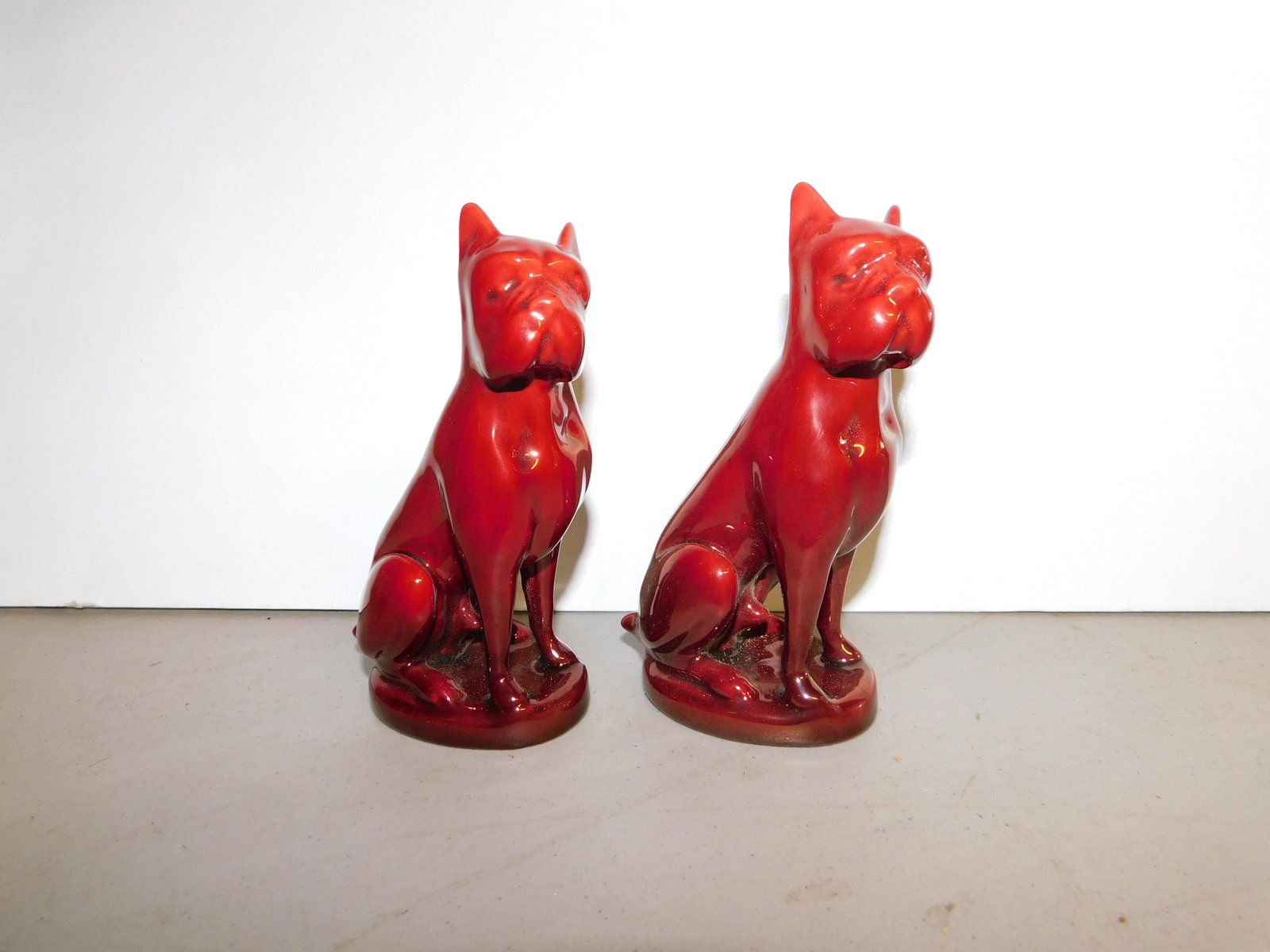 Pair of Zsolnay Eosin Art Pottery Bulldog Figurines: Pair of Zsolnay Eosin Art Pottery Bulldog Figurines. Measures 5" tall. You are bidding at a live sale. Please read the terms and conditions. We are offering no contact pick up at our South Brunswick l