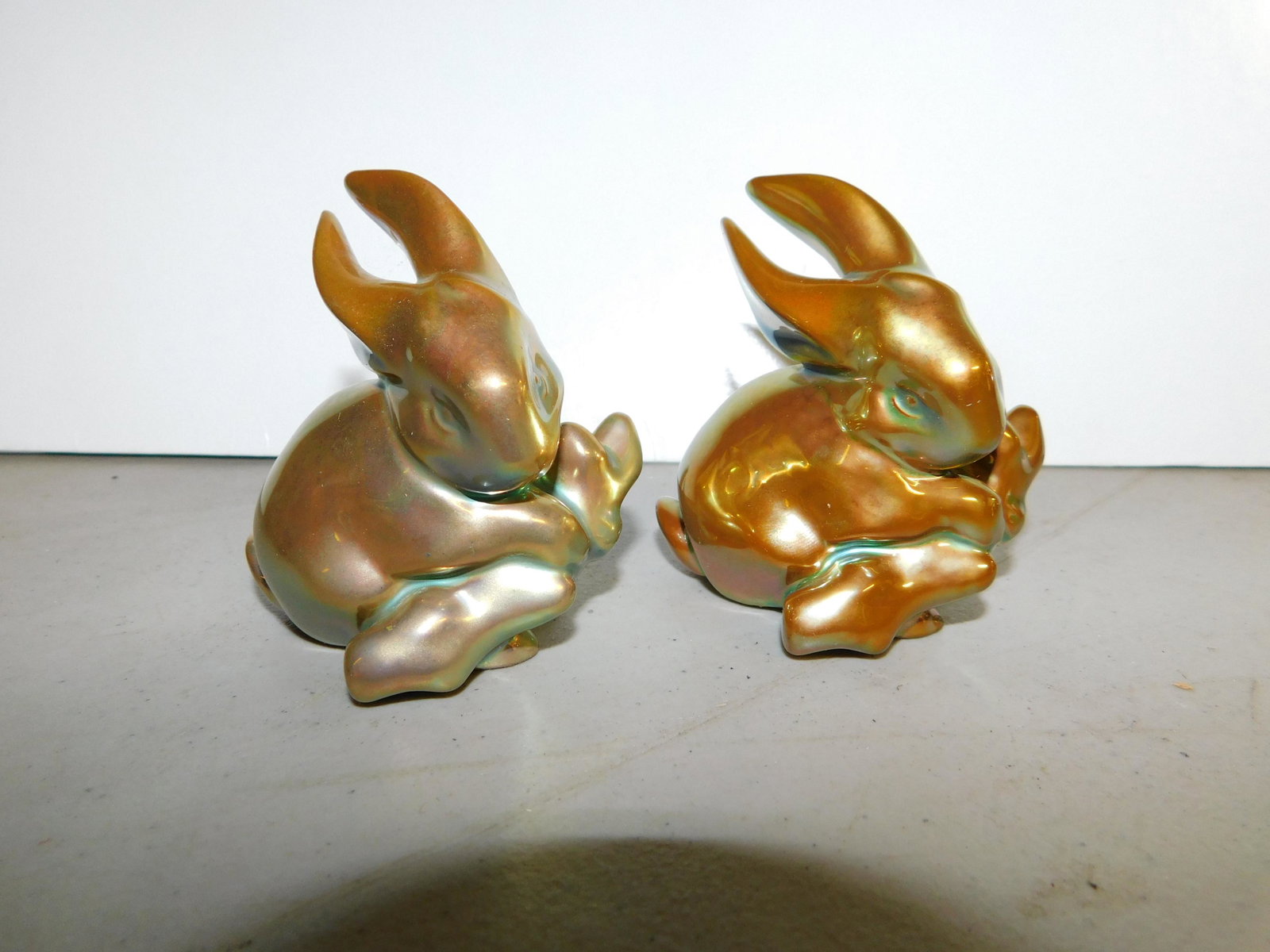 Pair of Zsolnay Eosin Art Pottery Bunny Rabbits: Pair of Zsolnay Eosin Art Pottery Bunny Rabbits. Measures 3" tall You are bidding at a live sale. Please read the terms and conditions. We are offering no contact pick up at our South Brunswick locati