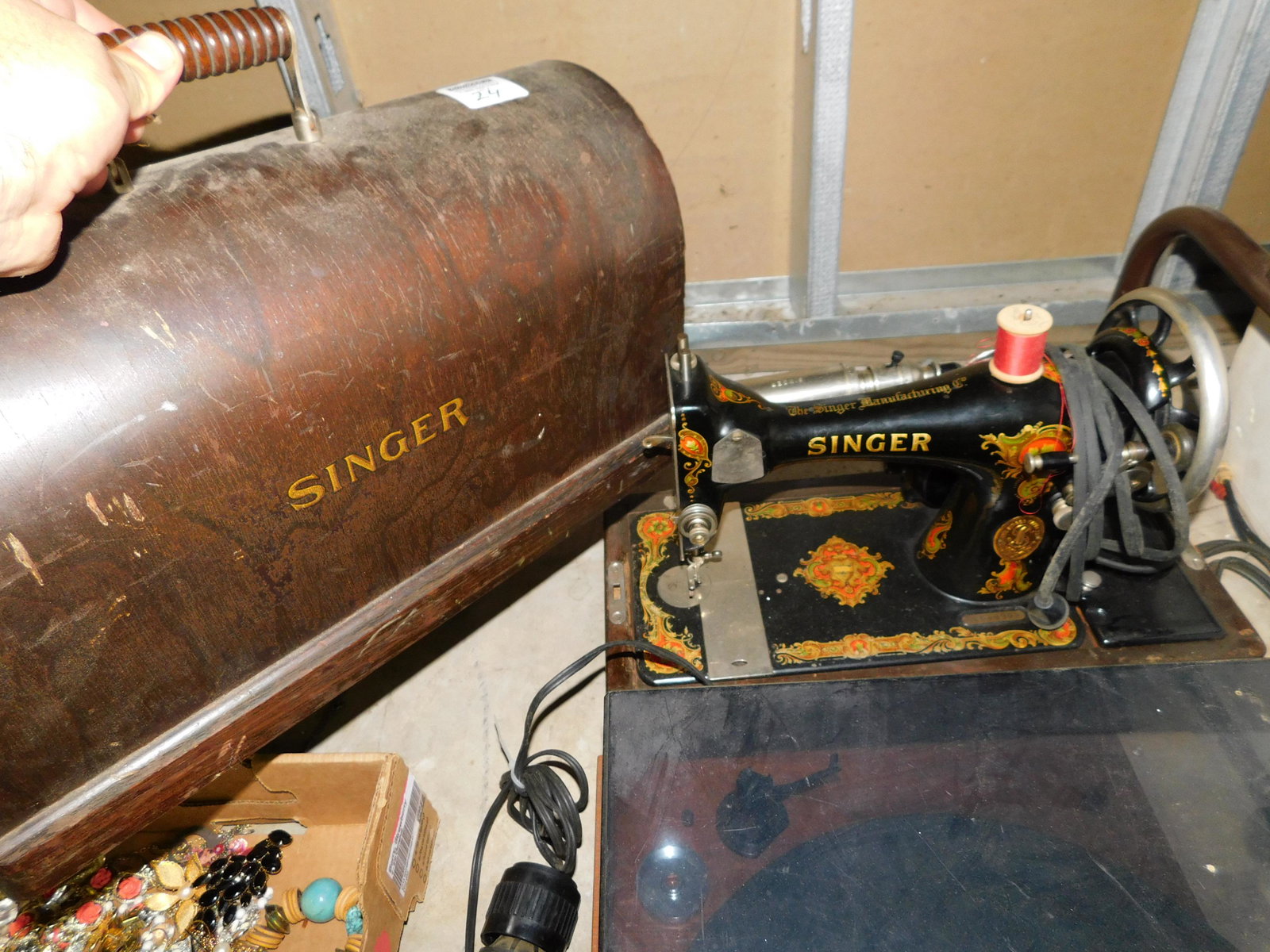 Singer Sewing Machine: Singer Sewing Machine You are bidding at a live sale. You are bidding at a live sale. Please read the terms and conditions. This sale will be broadcast live on sale day with full descriptions of each