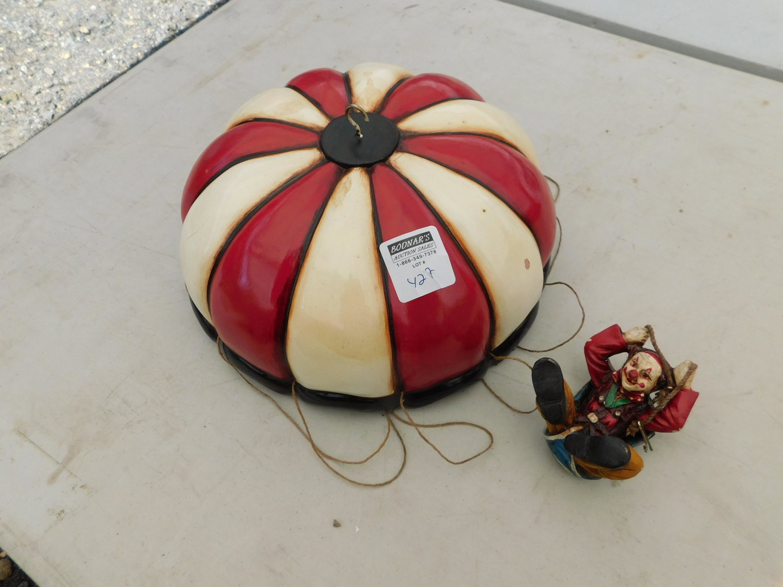 Clown parashute figurine: Clown parashute figurine measures 12 inches in diameter You are bidding at a live sale. You are bidding at a live sale. Please read the terms and conditions. This sale will be broadcast live on sale d