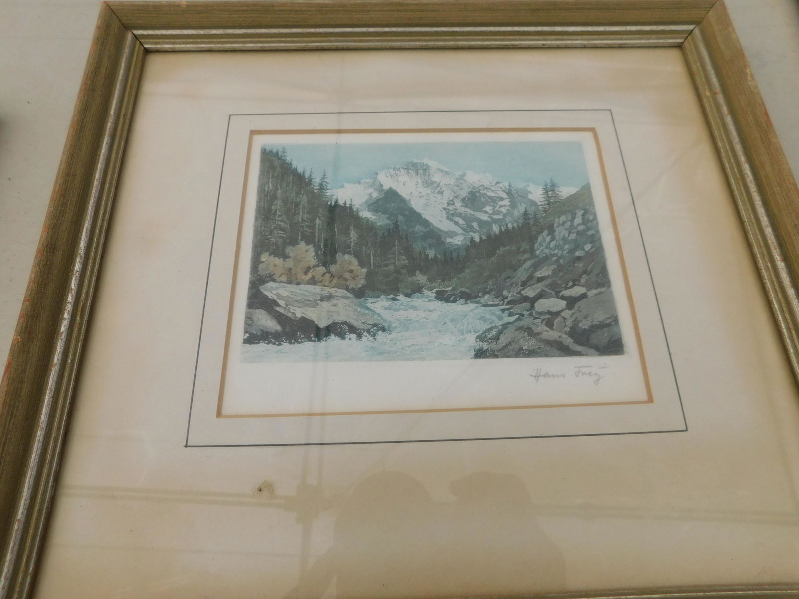 Hand Colored Engraving Mountain Scene: Hand Colored Engraving Mountain and River Scene. Signed Hans Frey. Image measures 5.5" L x 4.5" T You are bidding at a live sale. Please read the terms and conditions. We are offering no contact pick