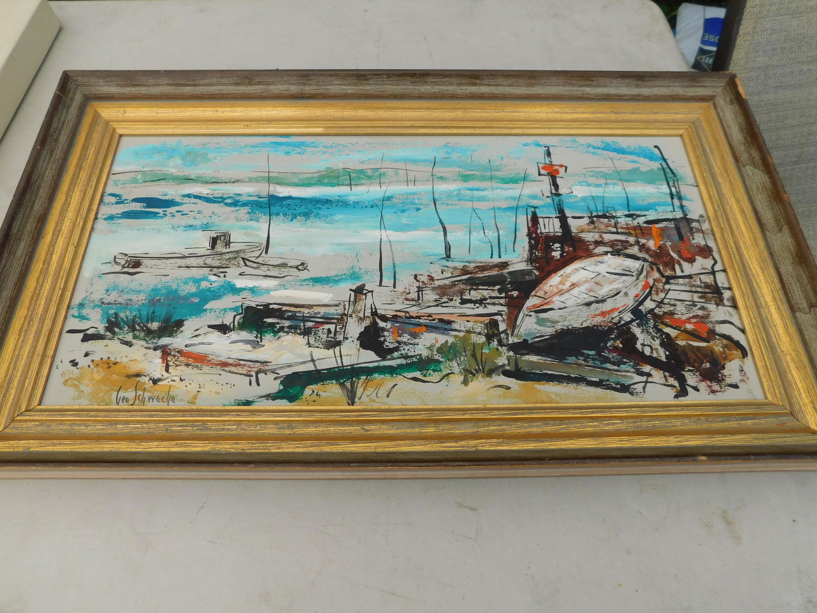 Oil on Masonite Ship Scene: Oil on Masonite. Signed Geo Schwacha. Depicts a boat and water scene. Image measures 23" L x 12" T You are bidding at a live sale. Please read the terms and conditions. We are offering no contact pick
