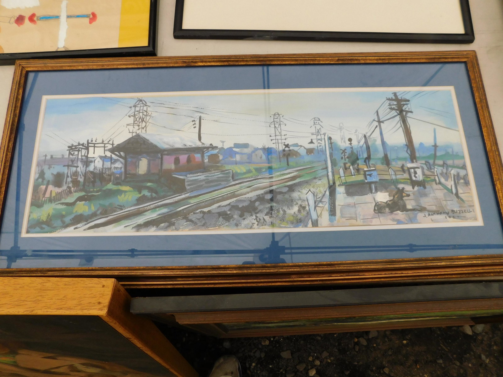 Watercolor of Train Station: Watercolor J Anthony Buzzelli. 1961. Depicts a Train Station. Image measures 24" L x 8" T You are bidding at a live sale. Please read the terms and conditions. We are offering no contact pick up at ou
