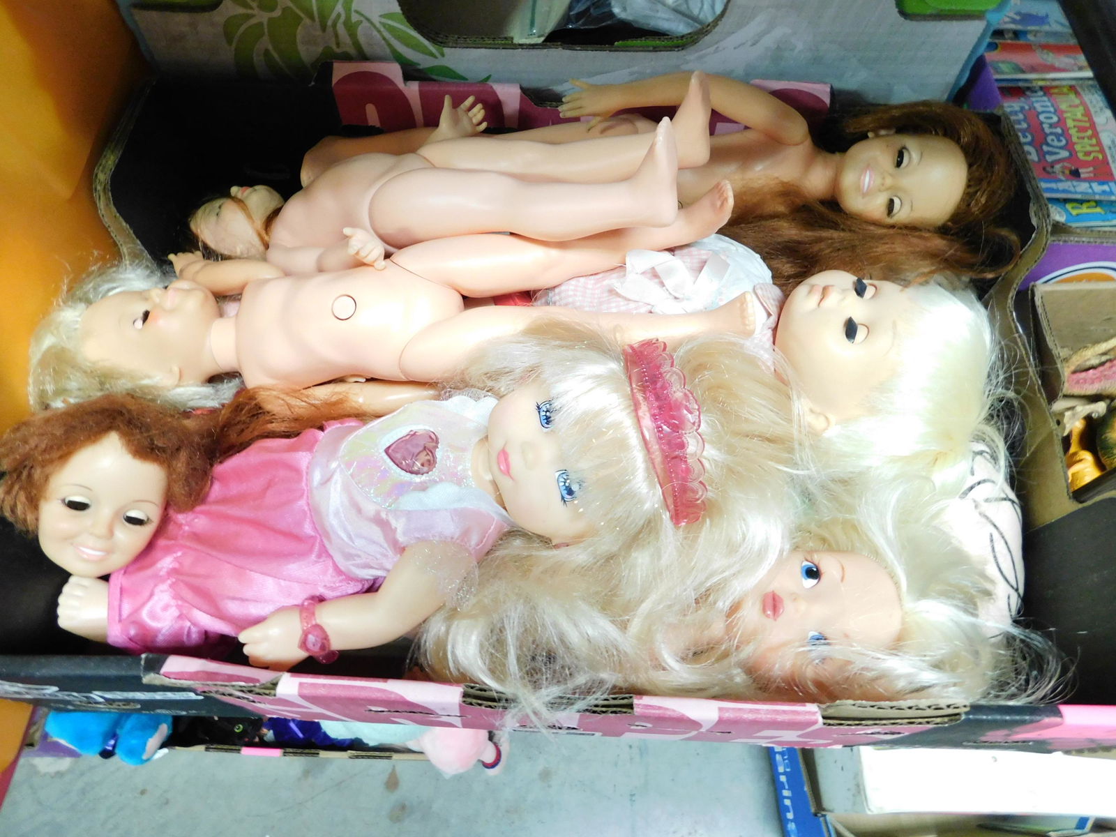 Box Lot of Dolls: Box Lot of Plastic and Vinyl Dolls. You are bidding at a live sale. Please read the terms and conditions. This sale will be broadcast live on sale day with full descriptions of each lot being sold, as