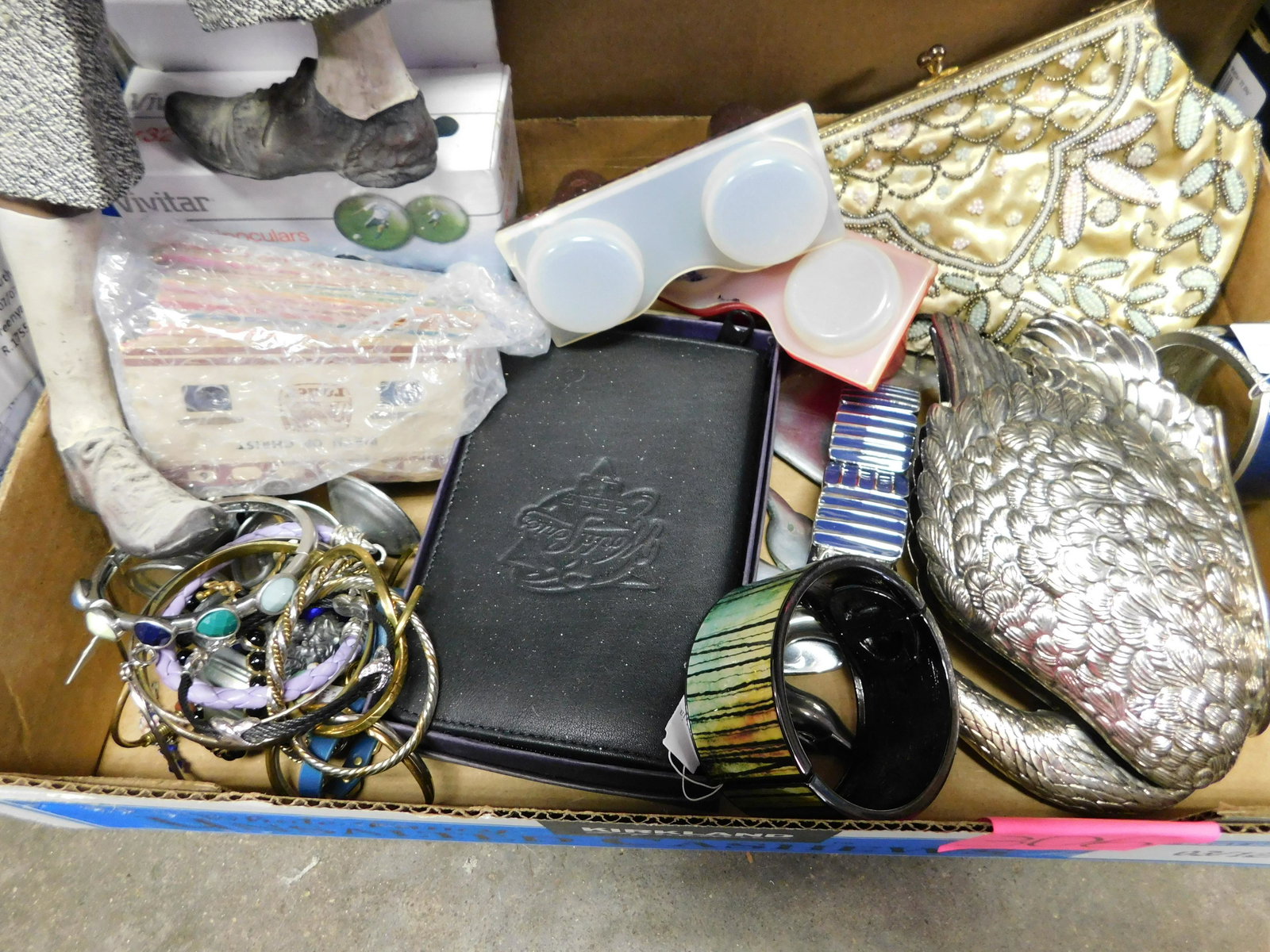 Box Lot of Bengal Bracelets, Purse, and More: Box lot with Bengal Bracelets, a Beaded Purse and More. You are bidding at a live sale. Please read the terms and conditions. This sale will be broadcast live on sale day with full descriptions of eac