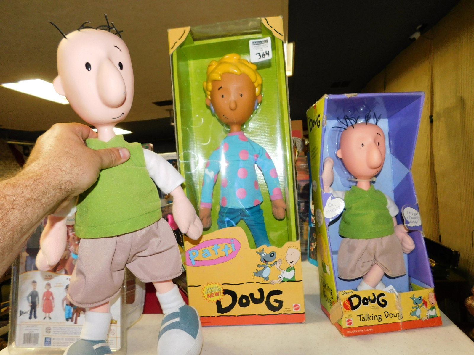 Doug Lot of 3: Doug Lot of 3 Figures. Included in this lot are a Boxed Patty, Talking Doug in Package, and a Loose Doug. You are bidding at a live sale. Please read the terms and conditions. This sale will be broadc