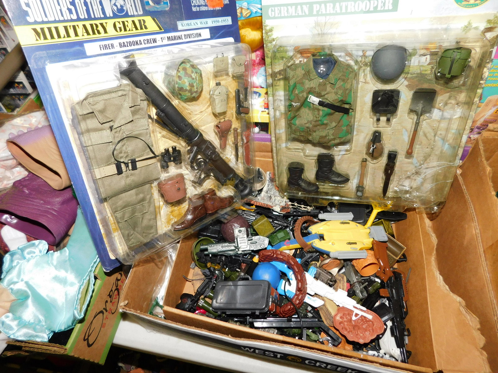 Box of G.I. Joe and Ultimate Soldier Weapons and: Lot of GI Joe and Ultimate Soldier Weapons and Accessories. You are bidding at a live sale. Please read the terms and conditions. This sale will be broadcast live on sale day with full descriptions of