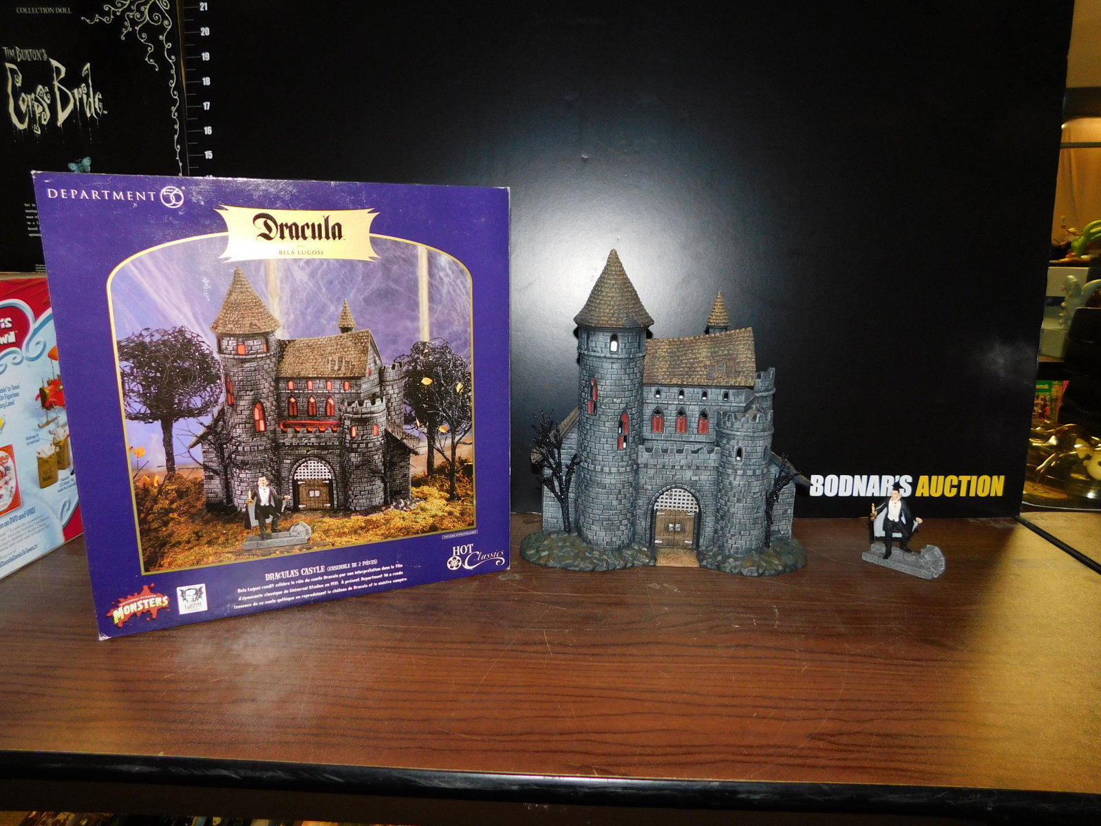 Department 56 Dracula's Castle with Bella Lugosi: Department 56 Dracula - Bella Lugosi Dracula's Castle with original box. Appears to be in excellent condition. Measures approx. 11 1/4" tall x 10 1/2" wide. You are bidding at a live sale, please read