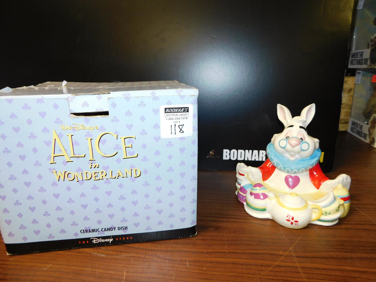 Disney Alice in Wonderland Candy Dish: Disney Alice in Wonderland candy dish from the Disney Store in original box. Measures approx. 6" tall x 7 1/2" wide. You are bidding at a live sale, please read the terms and conditions. We are offeri