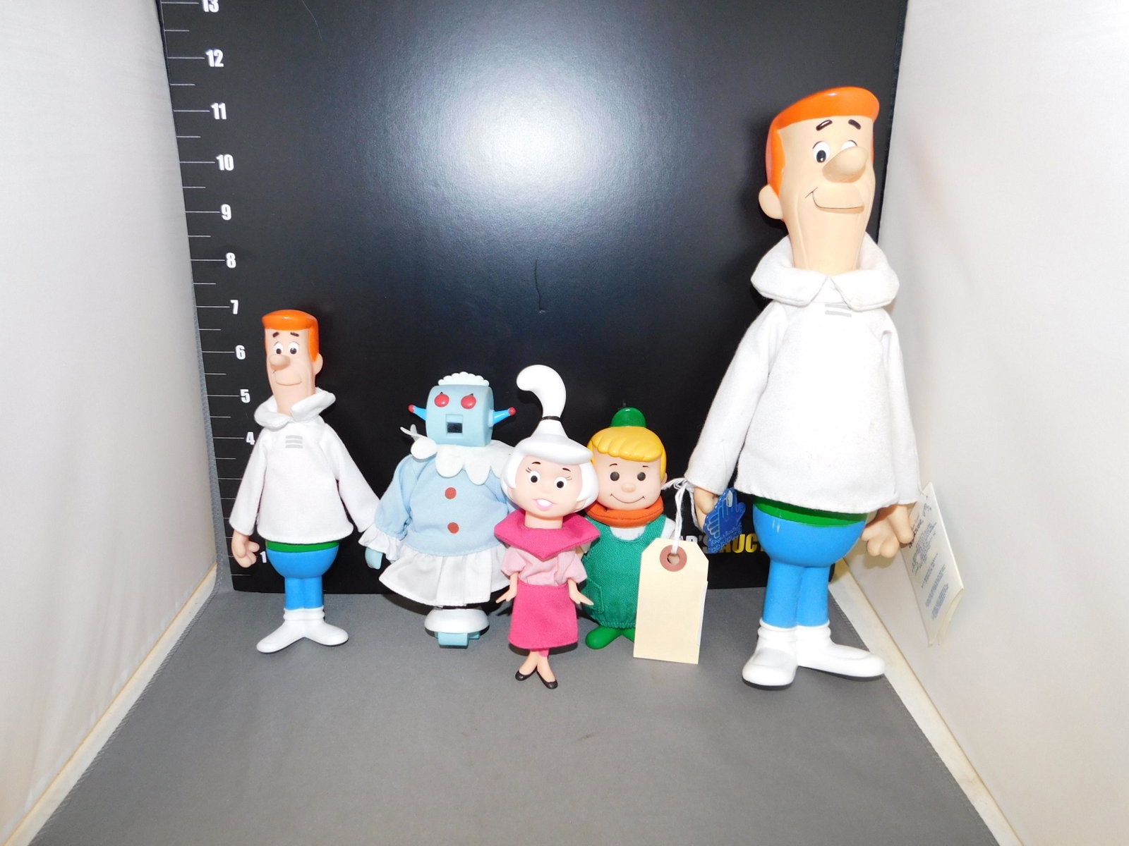 Lot of Jetson's Figures: Lot of Jetsons figures. Markings on the figures are illegible but it is possible they are applause. There is also a larger George Jetson applause figure. Measures approx. 5" - 11 1/2" tall. You are bi