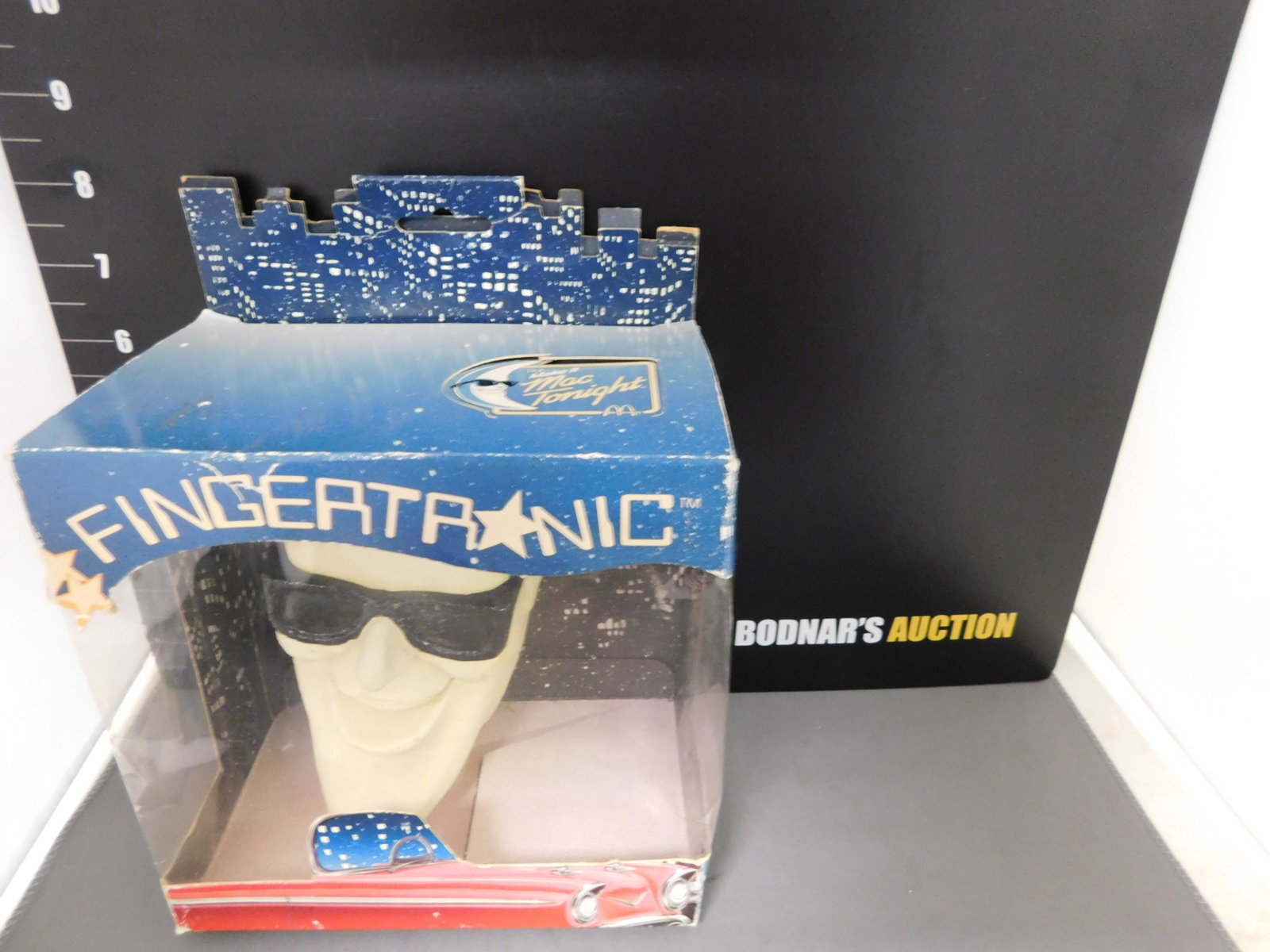 McDonald's Fingertronic Pupper Theater: Fingertronic Puppet Theater. McDonald's "Make it a Mac Tonight". Box and puppet have some wear. Comes in original Box. You are bidding at a live sale, please read the terms and conditions. We are offe