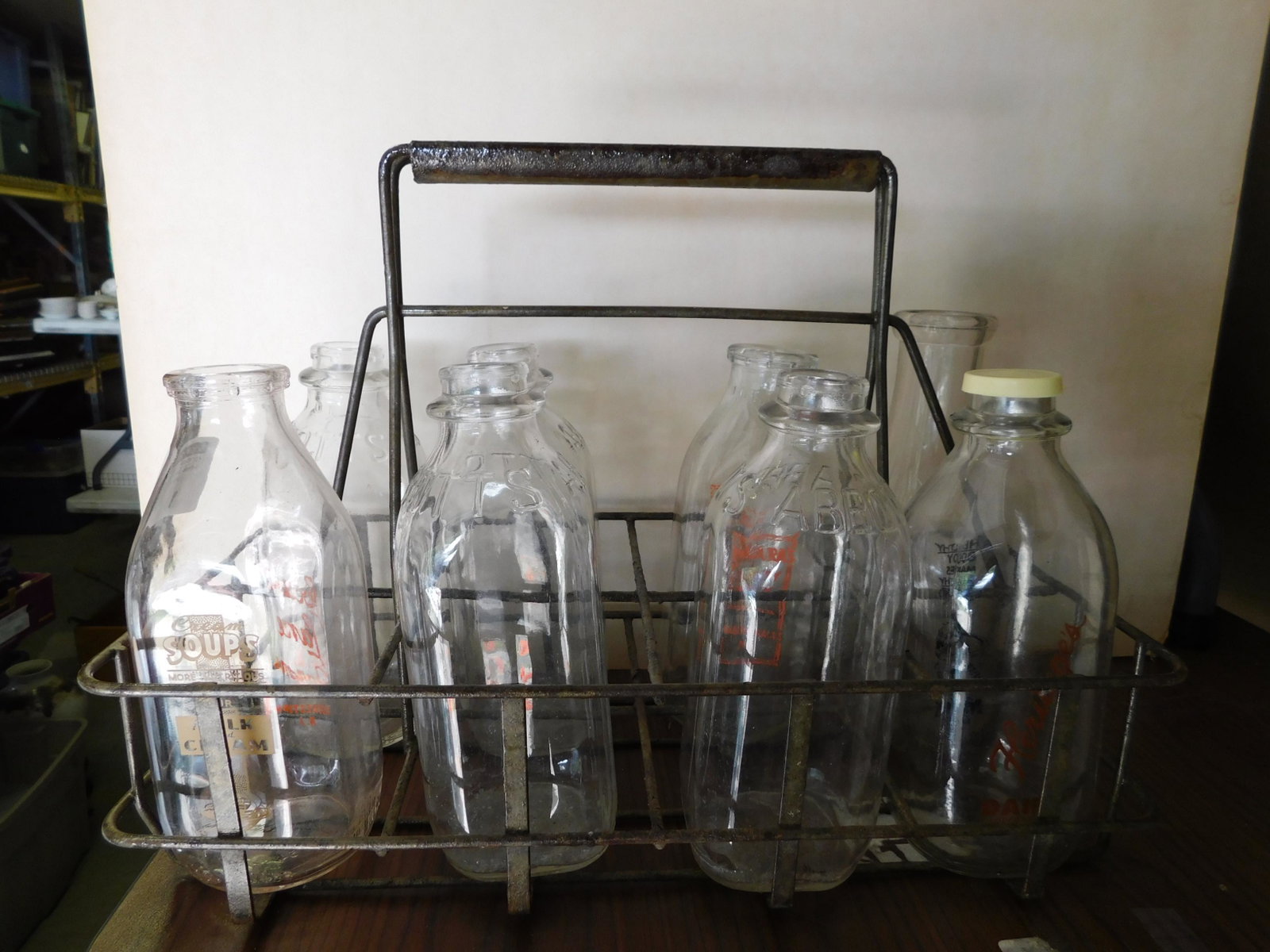 Vintage Milk Bottle Carrier with 8 Milk Bottles: Vintage Milk Bottle Carrier with 8 Milk Bottle. You are bidding at a live sale. Please read the terms and conditions. This sale will be broadcast live on sale day with full descriptions of each lot be