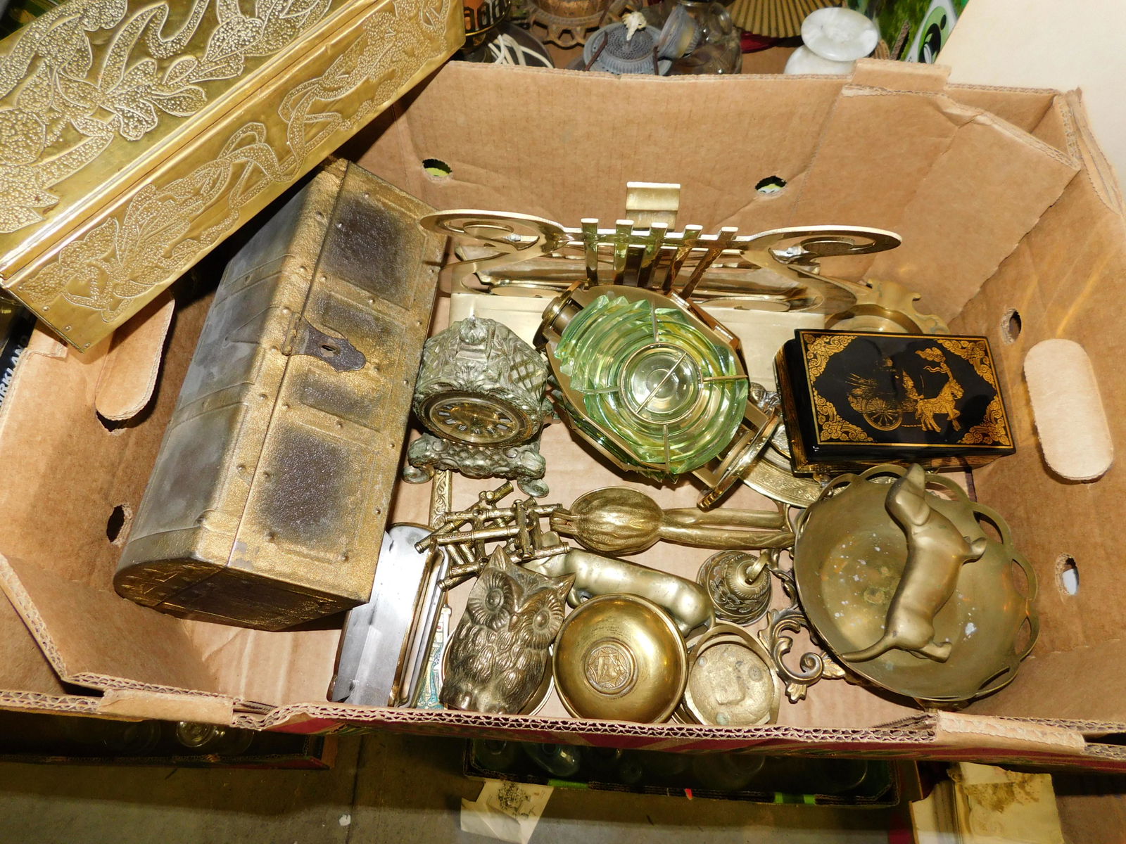 Box Lot of Brass: Box Lot of Brass. You are bidding at a live sale. Please read the terms and conditions. This sale will be broadcast live on sale day with full descriptions of each lot being sold, as well as video fee