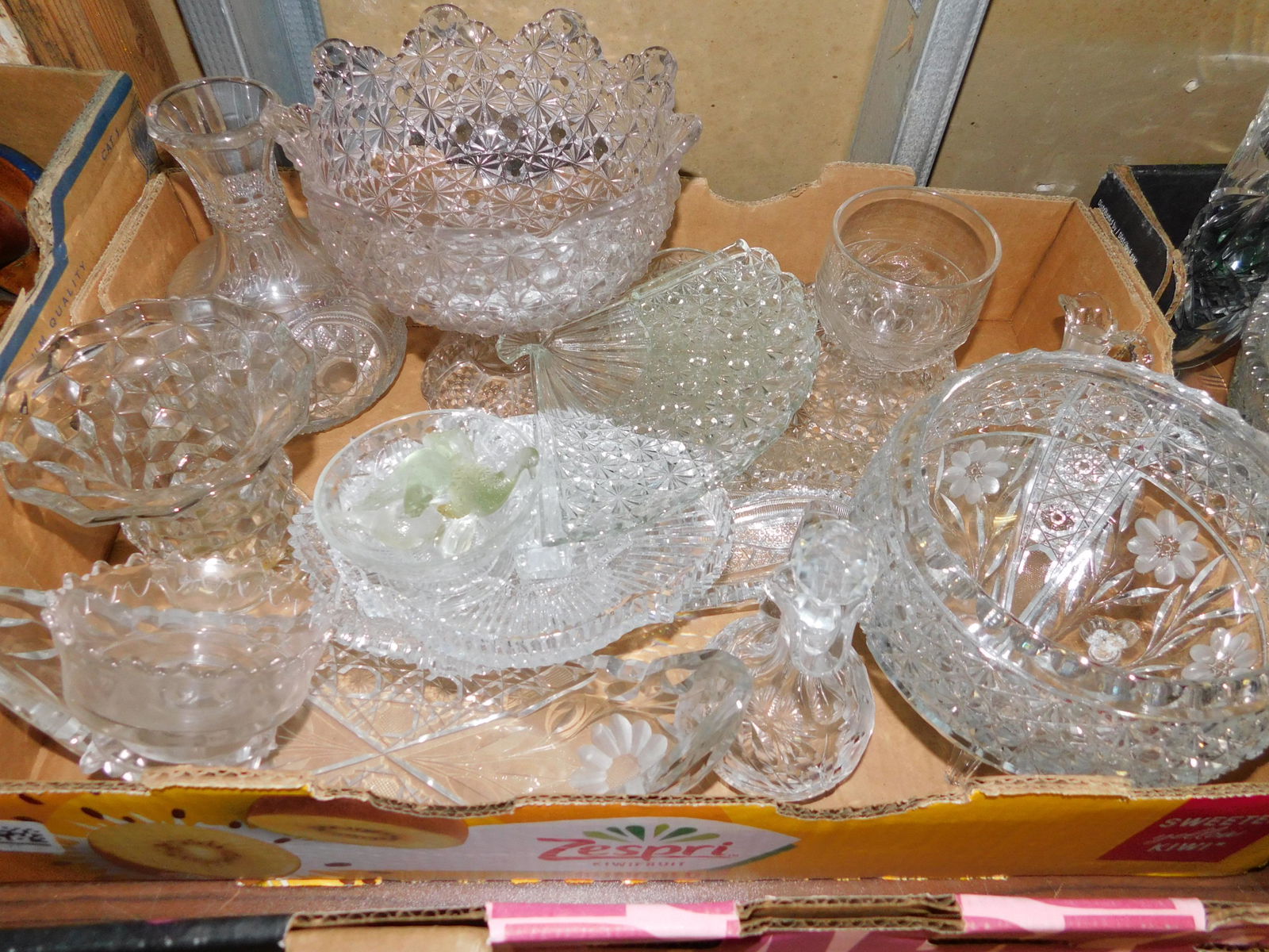 Box Lot of Pressed and Cut Glass: Box Lot of Pressed and Cut Glass. You are bidding at a live sale. Please read the terms and conditions. This sale will be broadcast live on sale day with full descriptions of each lot being sold, as w