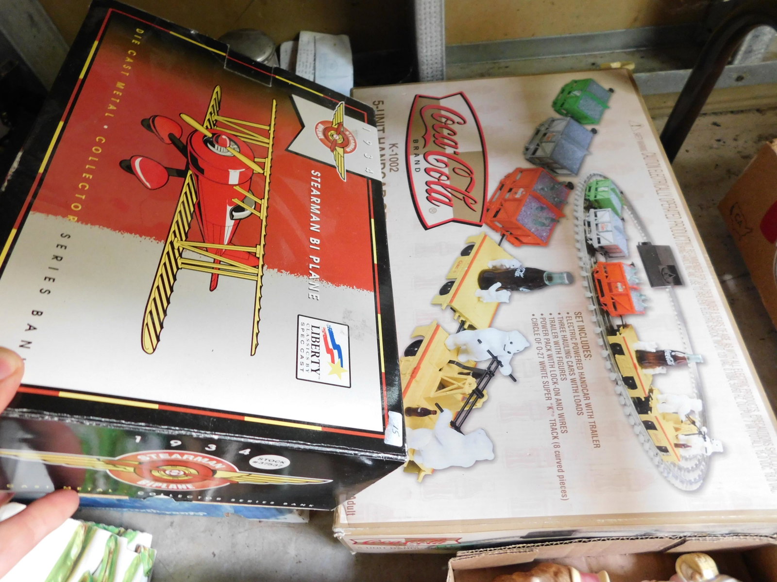 Die Cast Plane and Coca Cola Handcar: Die Cast Plane and Coca Cola Hand Car Set. You are bidding at a live sale. Please read the terms and conditions. This sale will be broadcast live on sale day with full descriptions of each lot being s