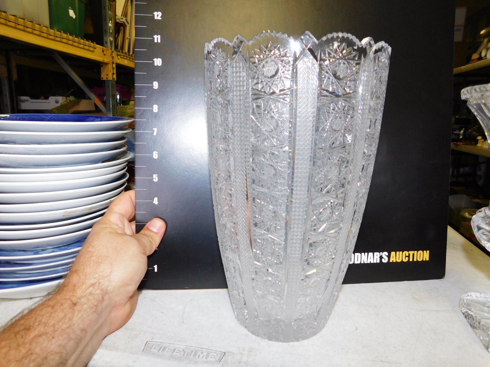 Cut Glass Tall Vase: Cut Glass Tall Glass Czech. Vase. Measures 10" tall. You are bidding at a live sale. Please read the terms and conditions. This sale will be broadcast live on sale day with full descriptions of each l