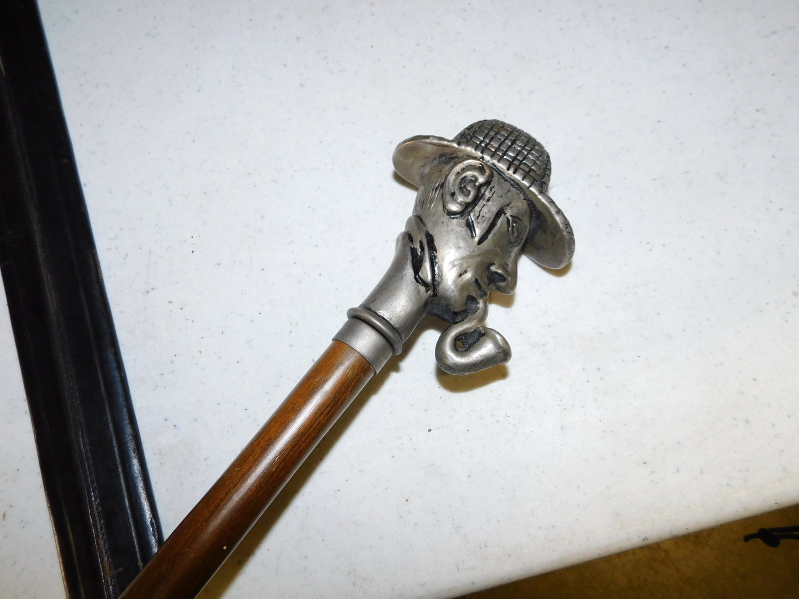Sherlock Holmes Figural Head Walking Stick: Sherlock Holmes Figural Head Walking Stick. Measures 37". You are bidding at a live sale. Please read the terms and conditions. This sale will be broadcast live on sale day with full descriptions of e