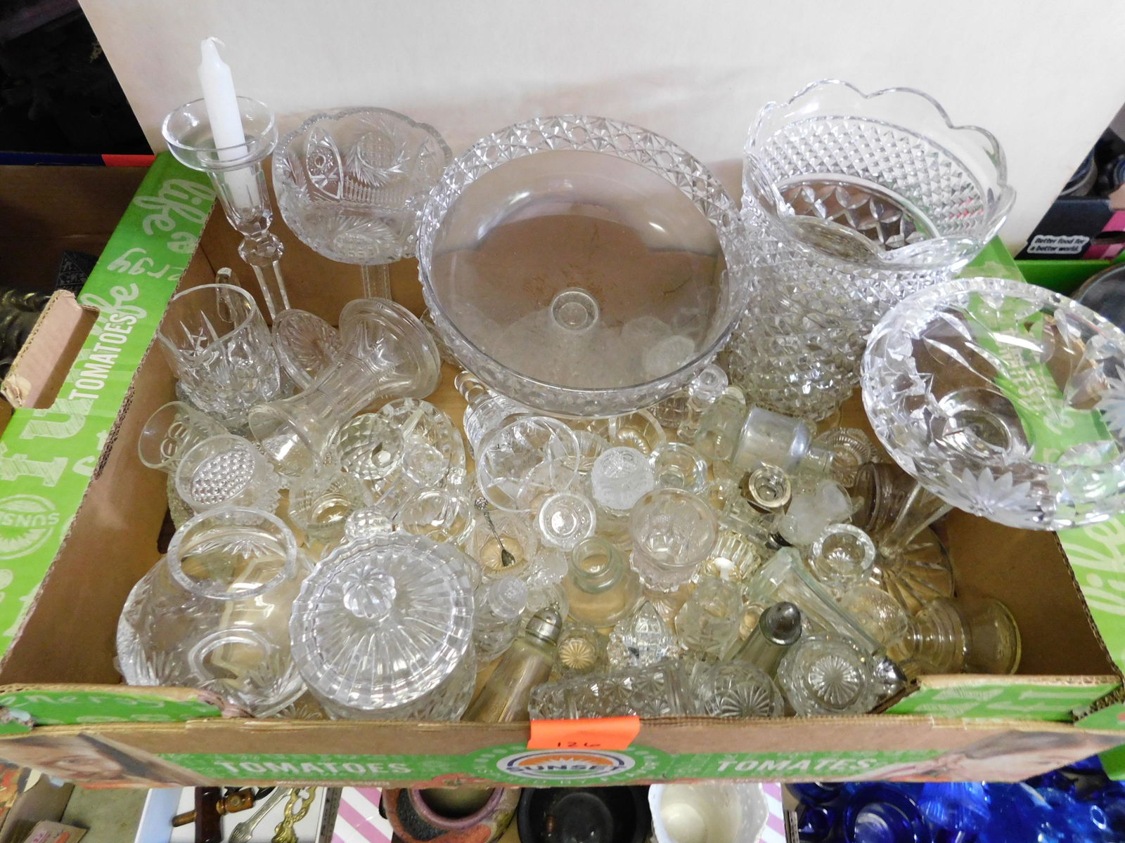 Box Lot of Cut and Pressed Glass: Box Lot of Cut Glass and Pressed Glass. You are bidding at a live sale. Please read the terms and conditions. This sale will be broadcast live on sale day with full descriptions of each lot being sold