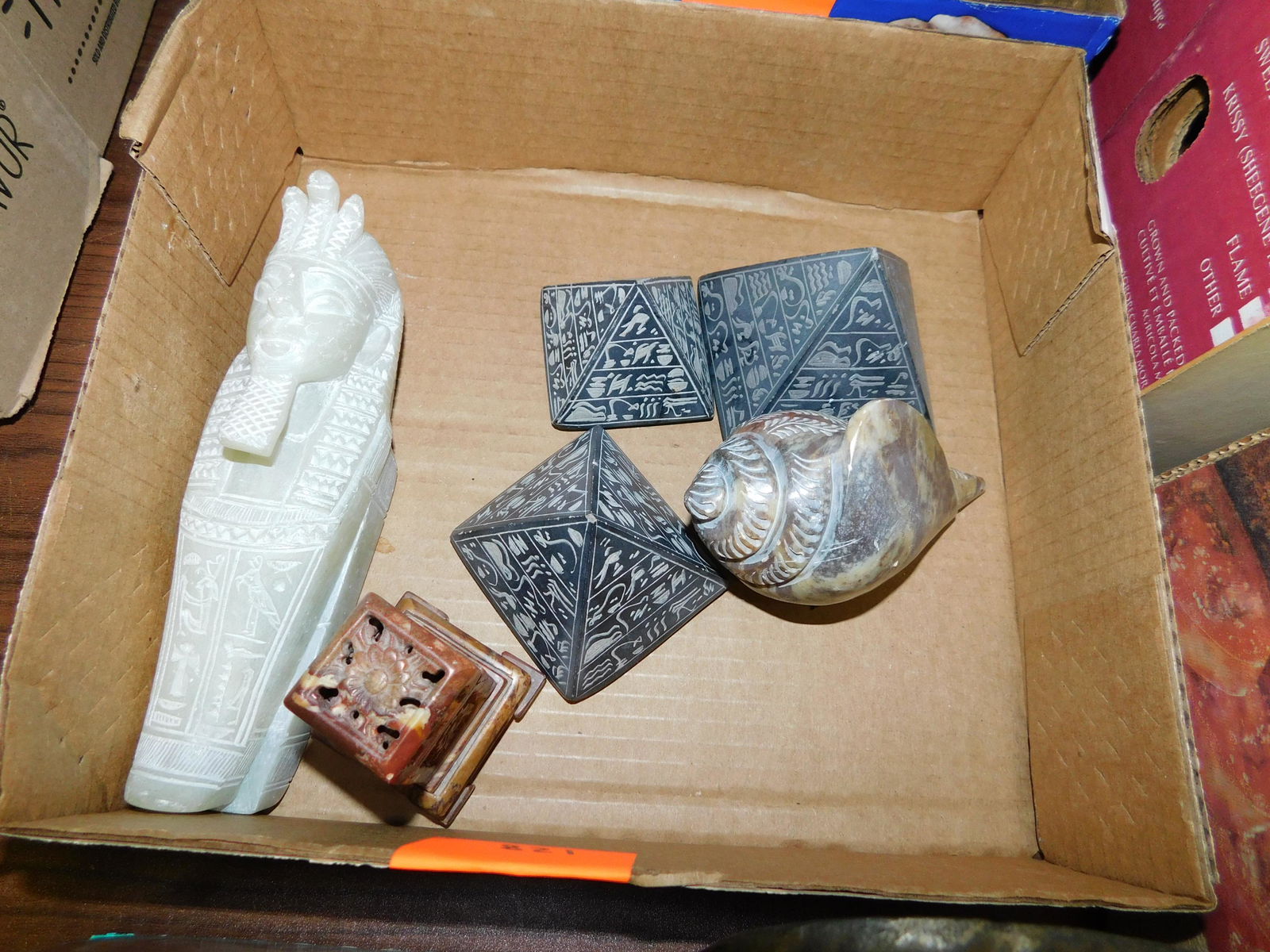 Box Lot of Soapstone: Box Lot of Soapstone. You are bidding at a live sale. Please read the terms and conditions. This sale will be broadcast live on sale day with full descriptions of each lot being sold, as well as video