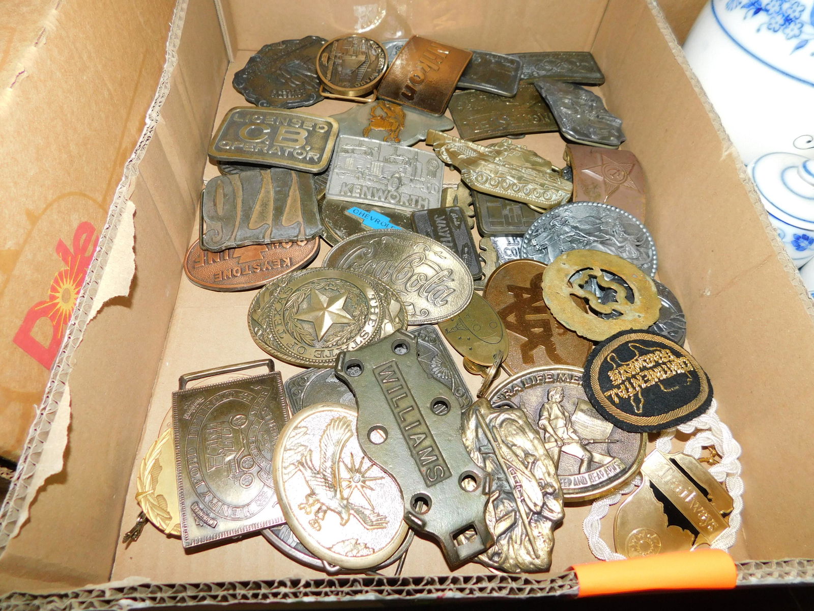 Large Box of Belt Buckles: Large Box Lot of Belt Buckles. You are bidding at a live sale. Please read the terms and conditions. This sale will be broadcast live on sale day with full descriptions of each lot being sold, as well